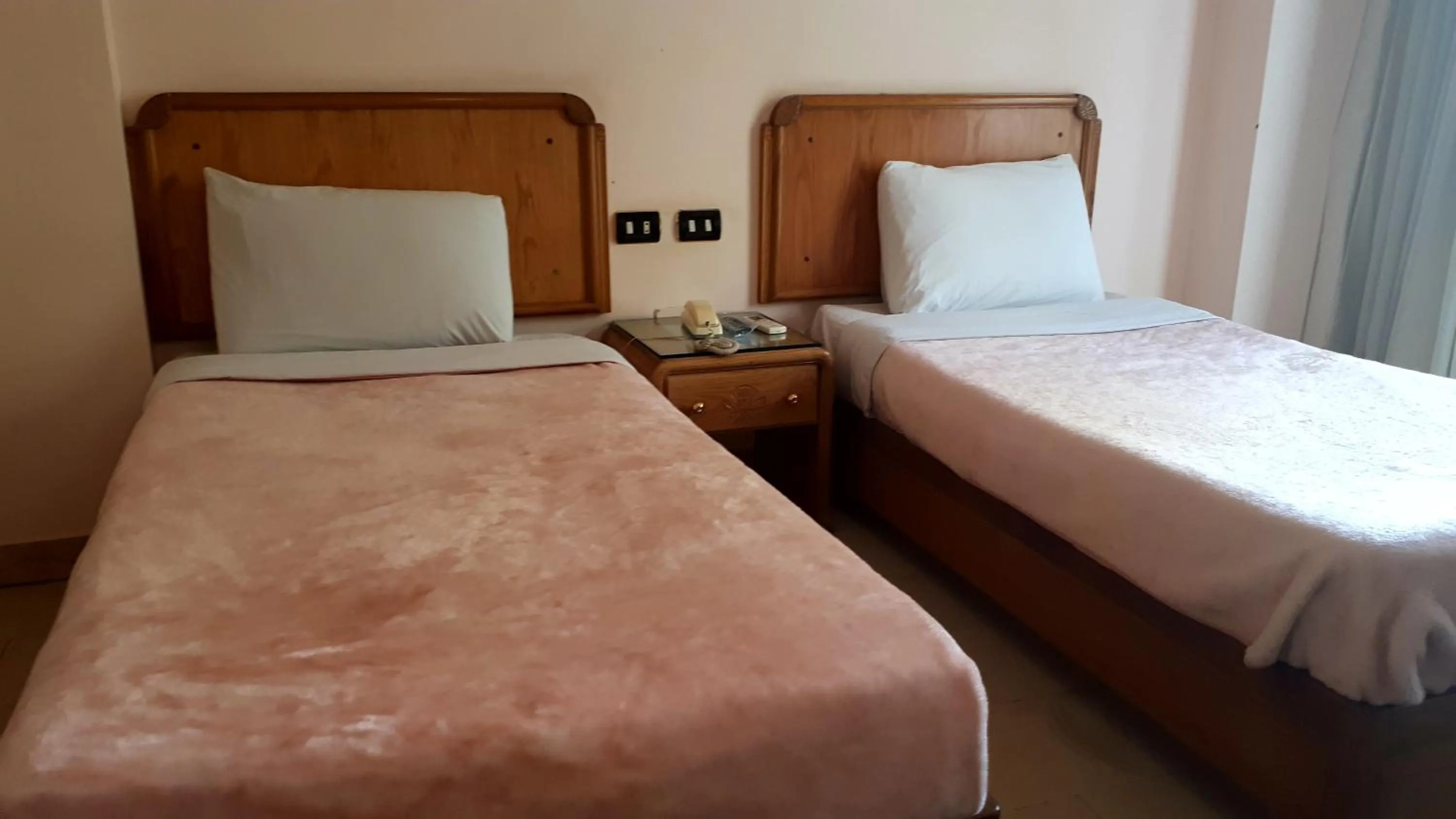 Bed in New Pola Hotel