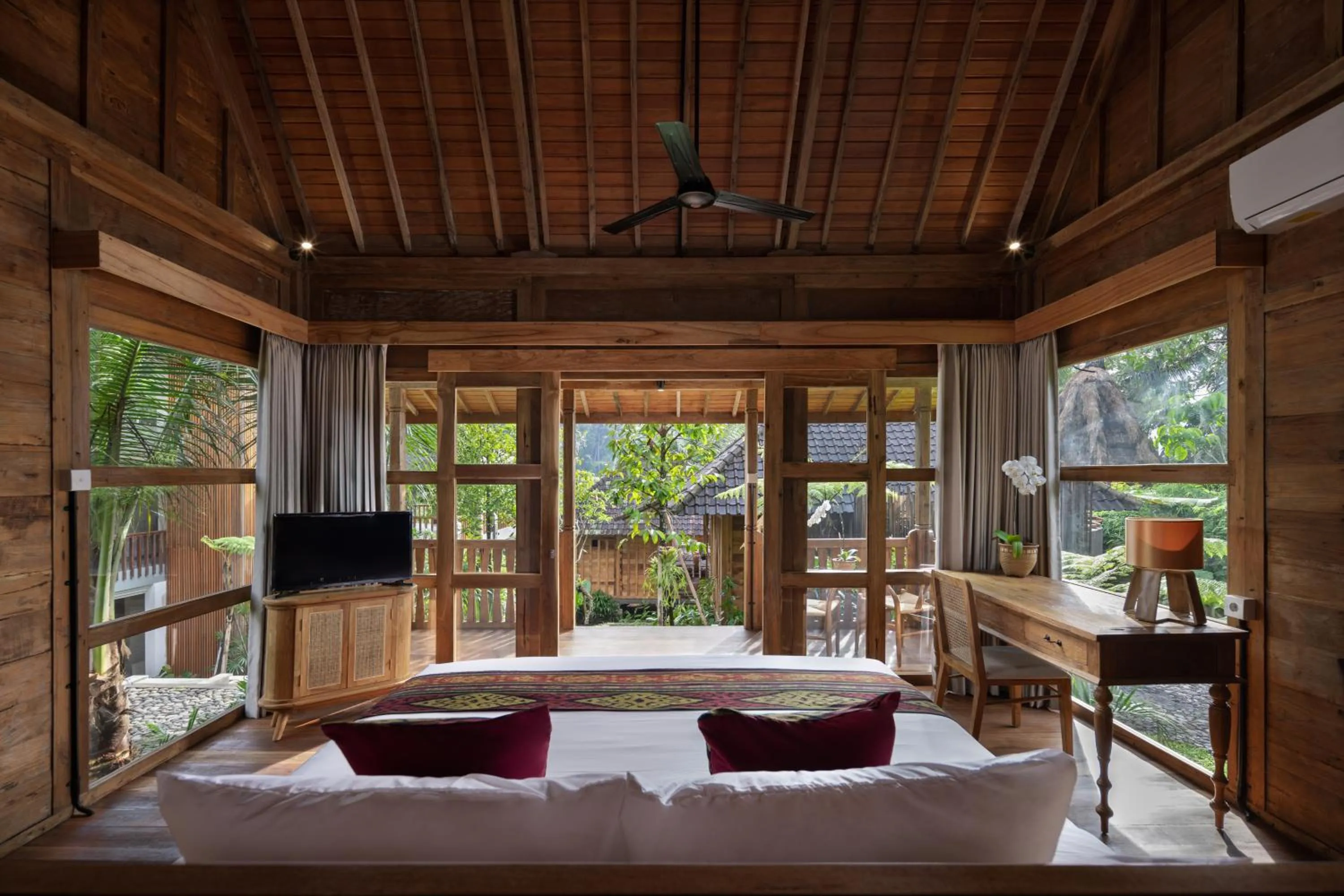 Bed in RUMAH KAYU RESORT