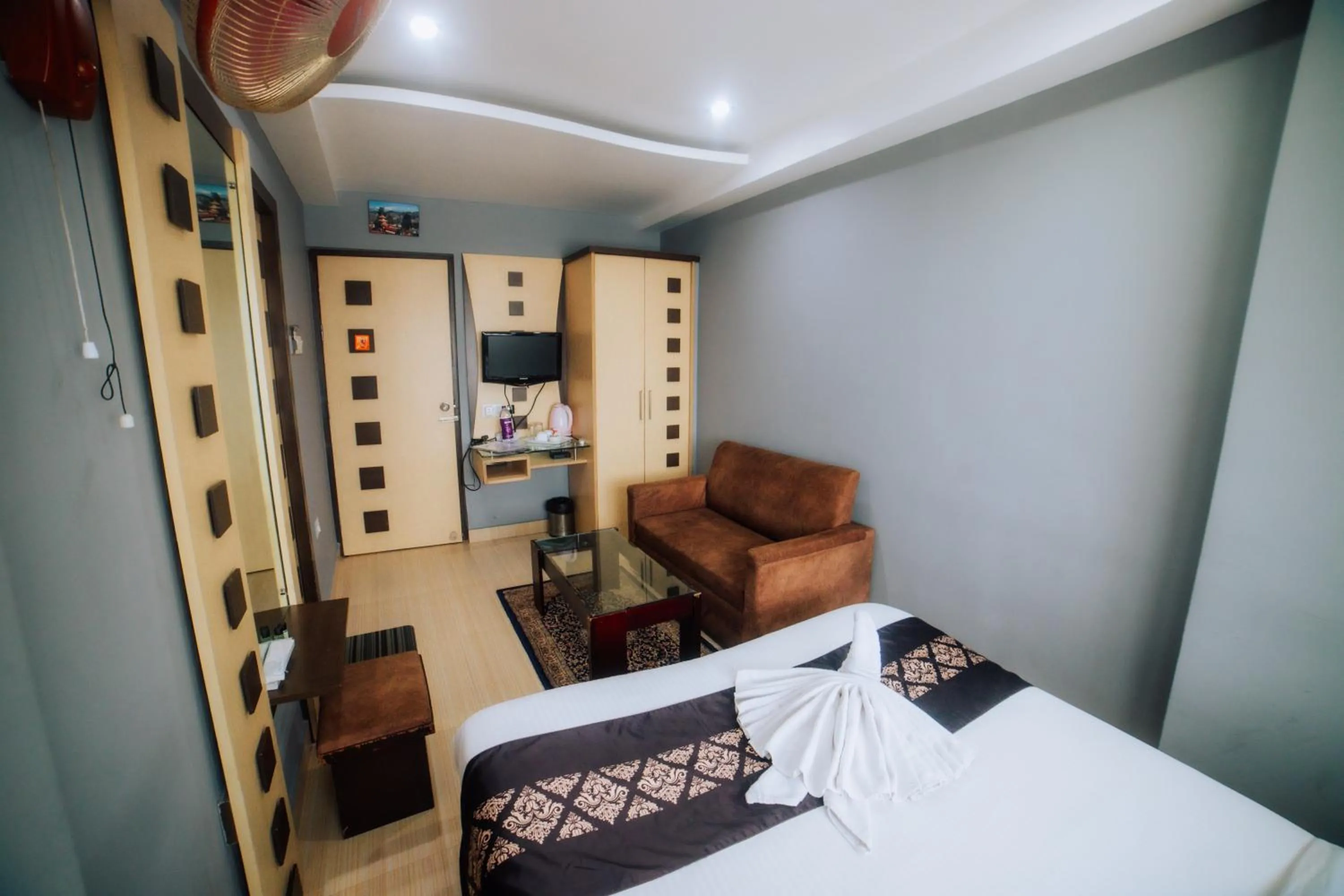 Bed in Amarjeet Hotel