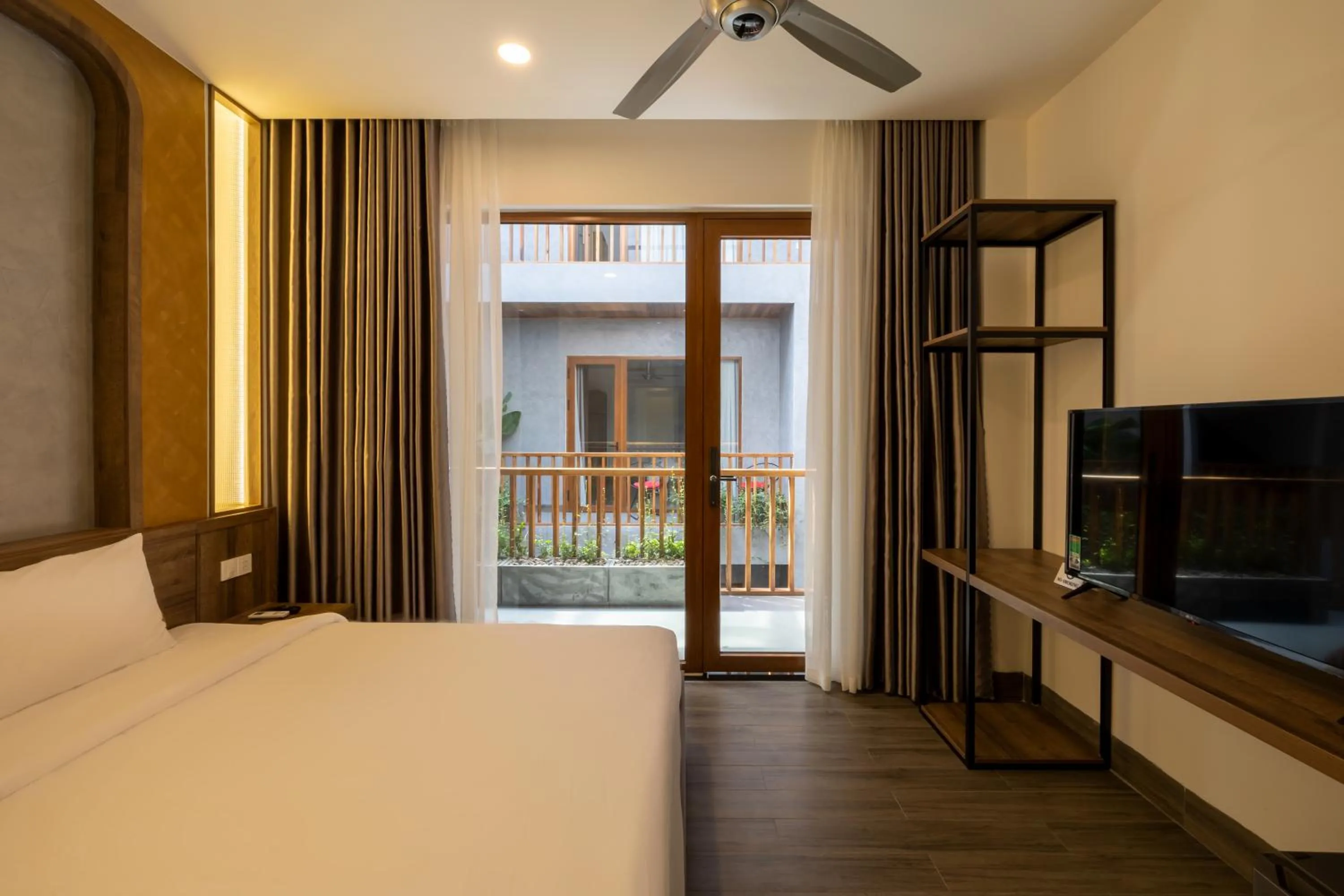 Communal lounge/ TV room, Bed in Moon Sun Boutique Villa Hotel