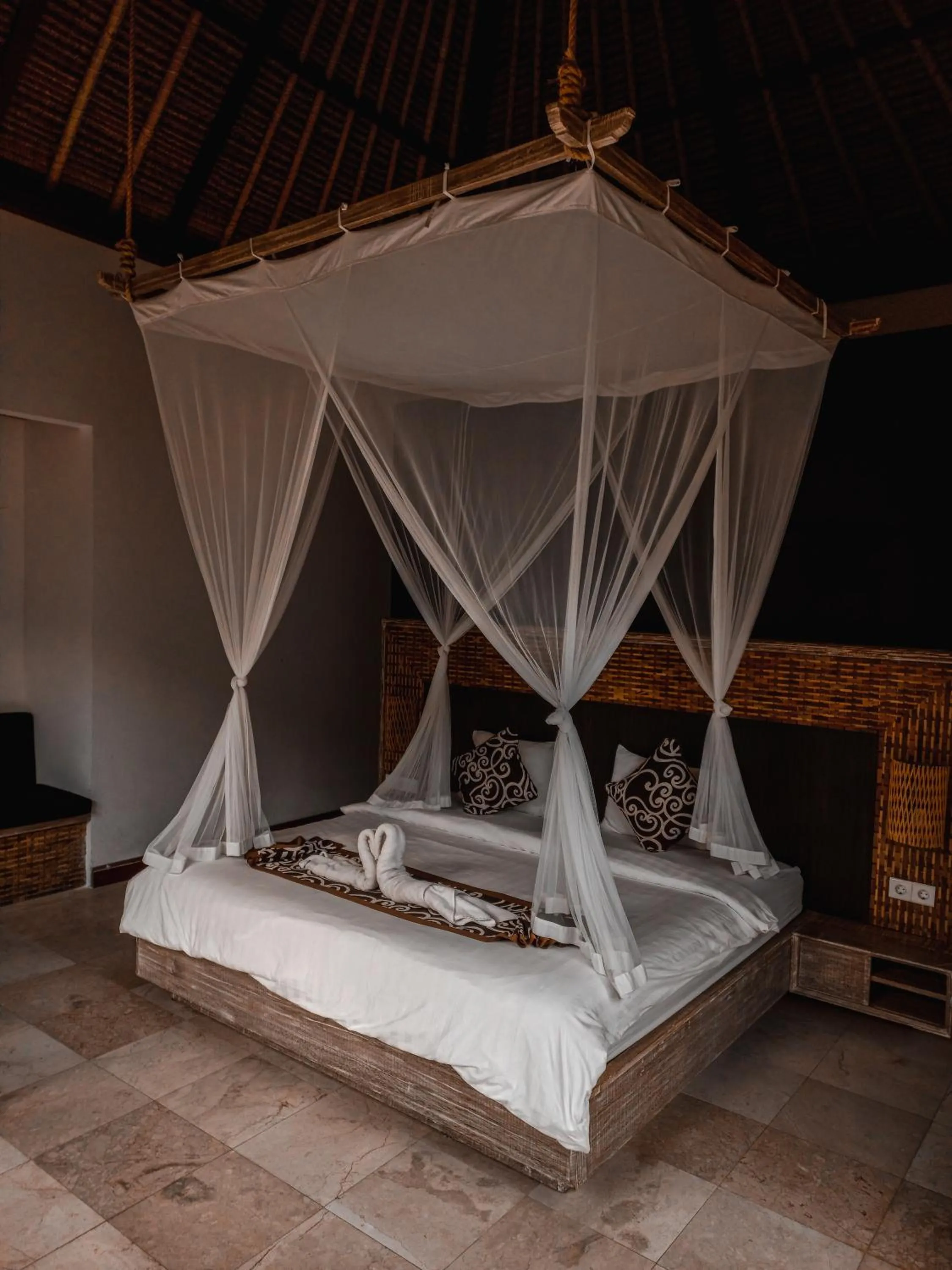 Bed in The Tirta Sari Villas
