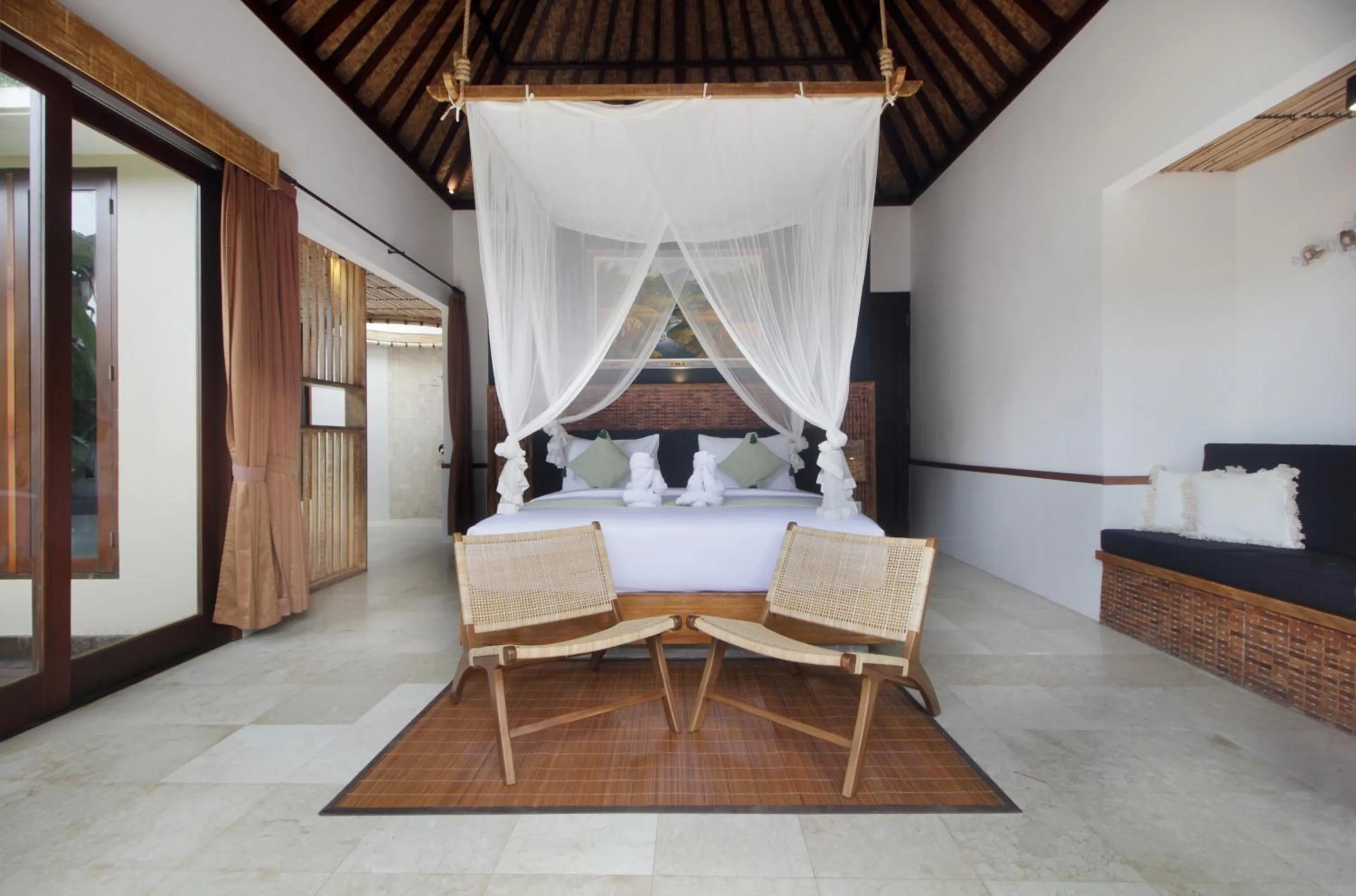 Bed in The Tirta Sari Villas