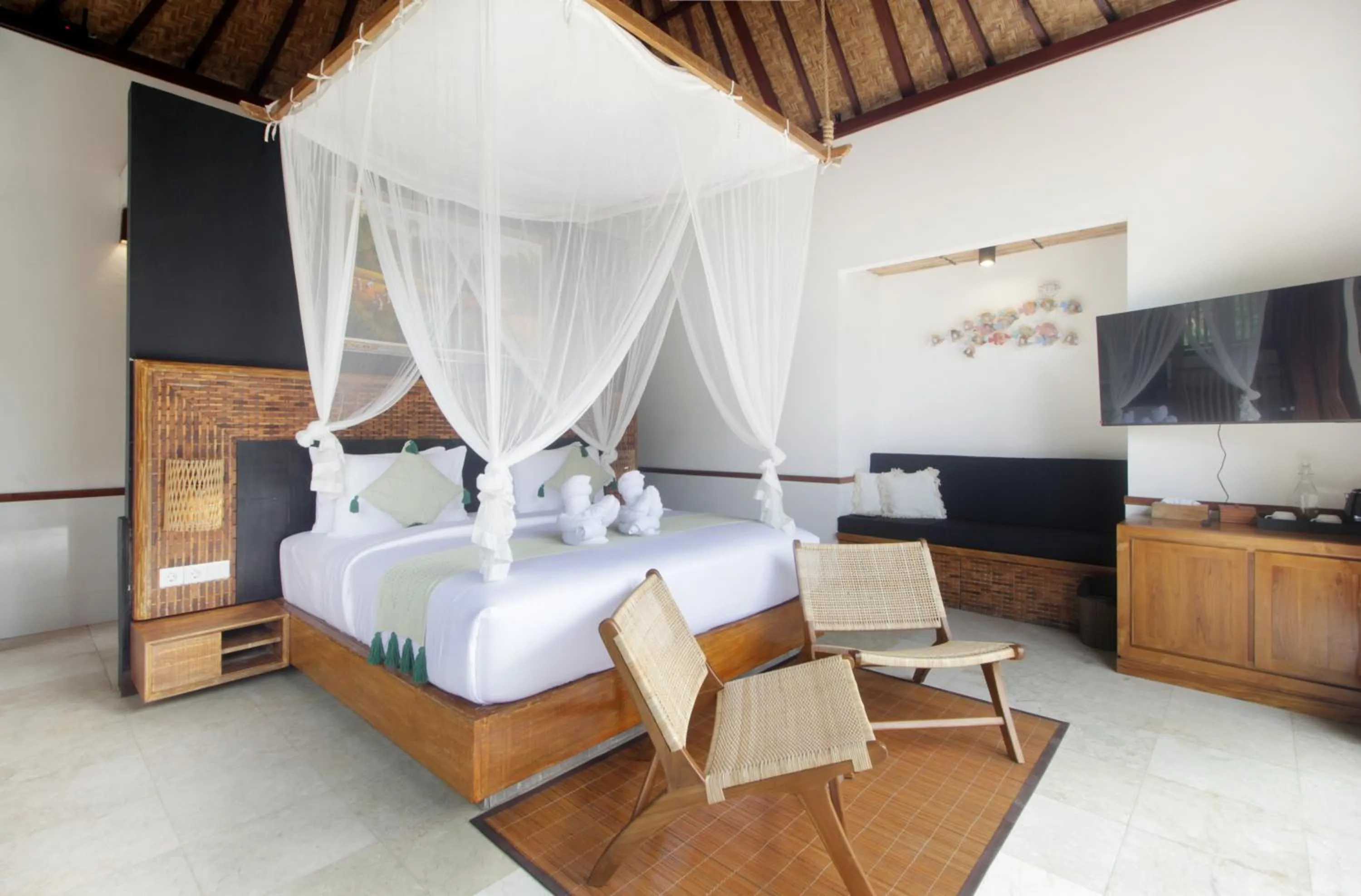 Bed in The Tirta Sari Villas