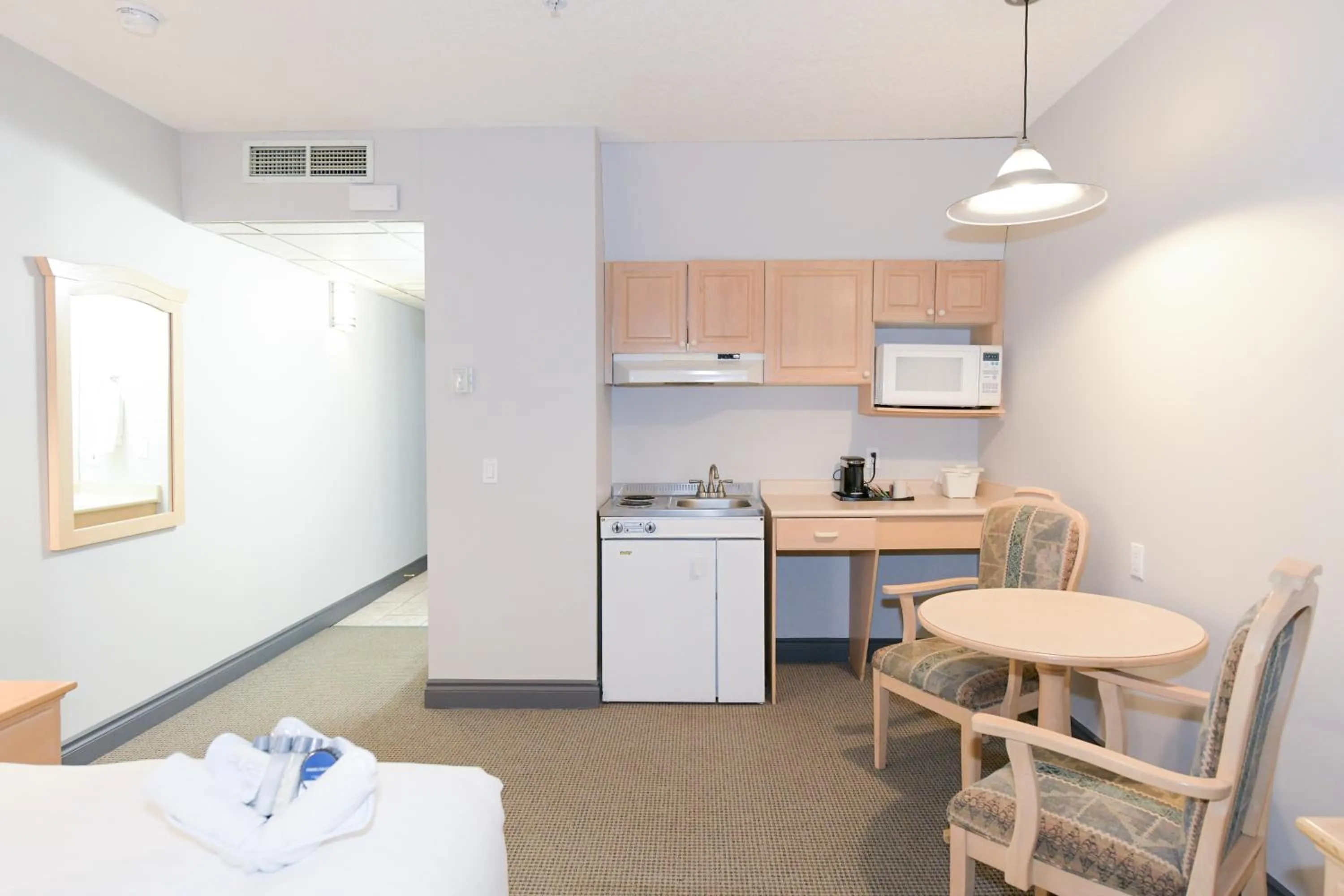 Kitchen or kitchenette, Bed in Prime Hotel