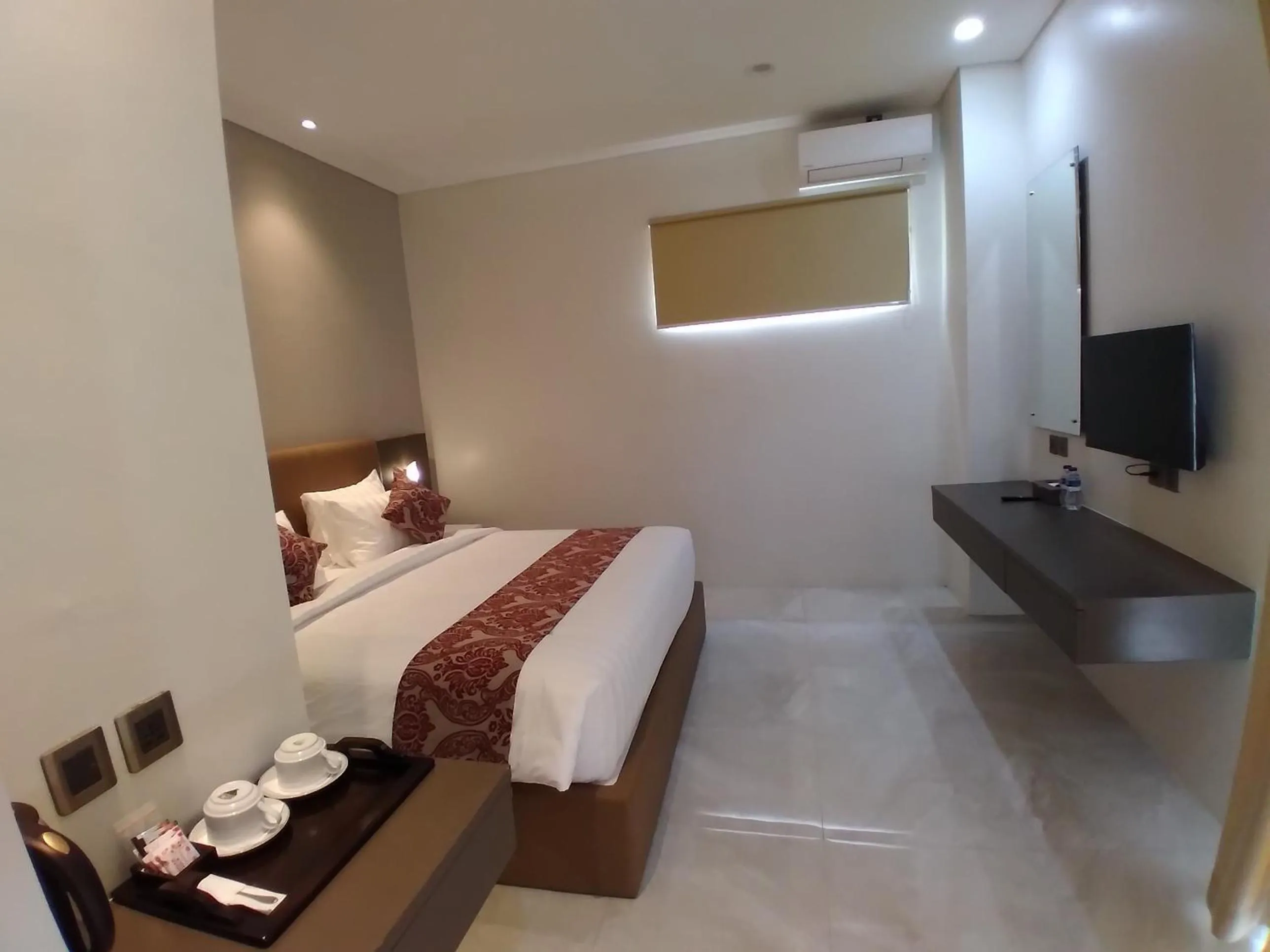 Bed in PURNAMA BALIGE HOTEL
