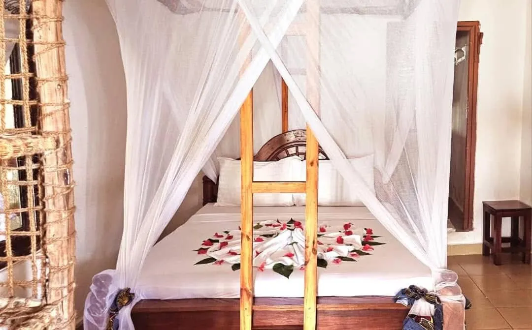 Bed in Sipano Beach Lodge Kiwengwa