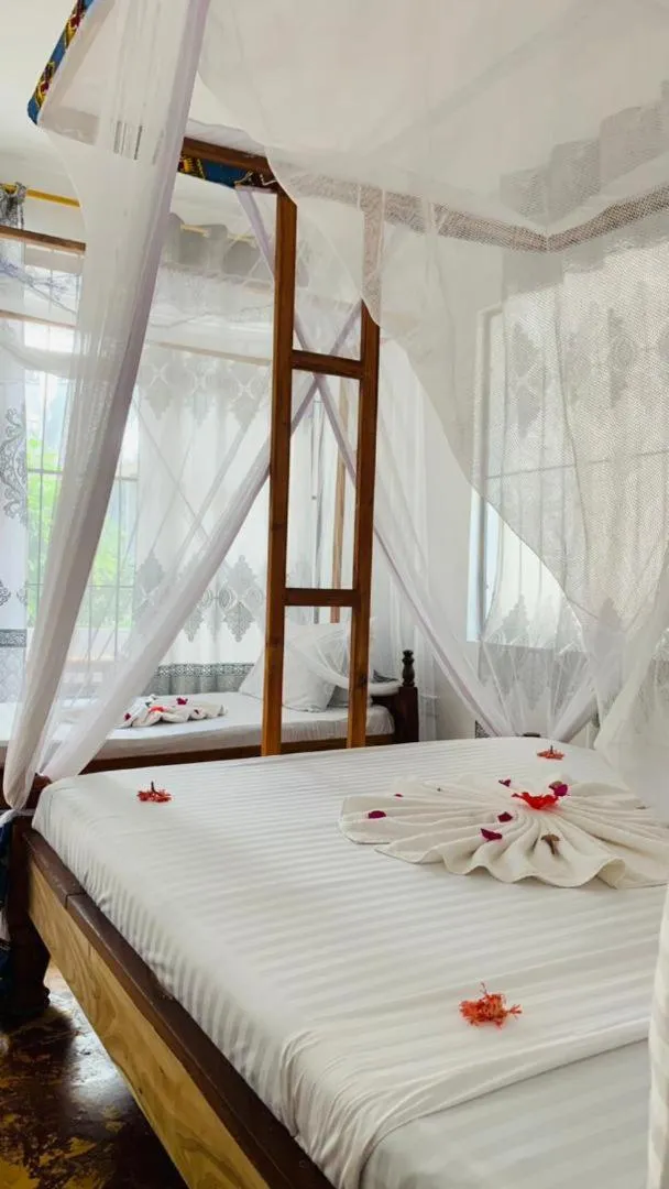 Bed in Sipano Beach Lodge Kiwengwa