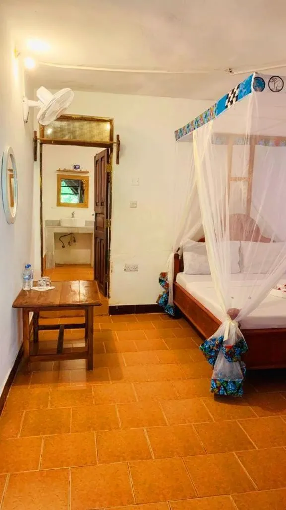 Bed in Sipano Beach Lodge Kiwengwa