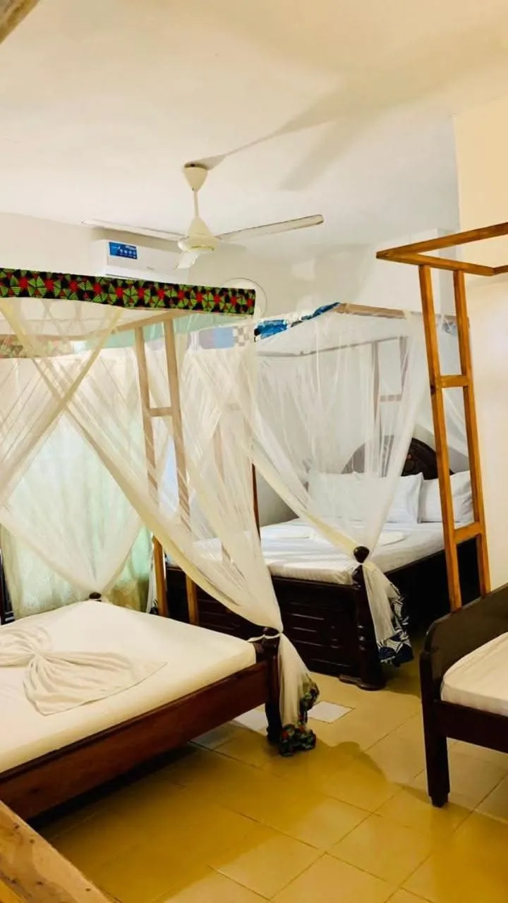 Bed in Sipano Beach Lodge Kiwengwa