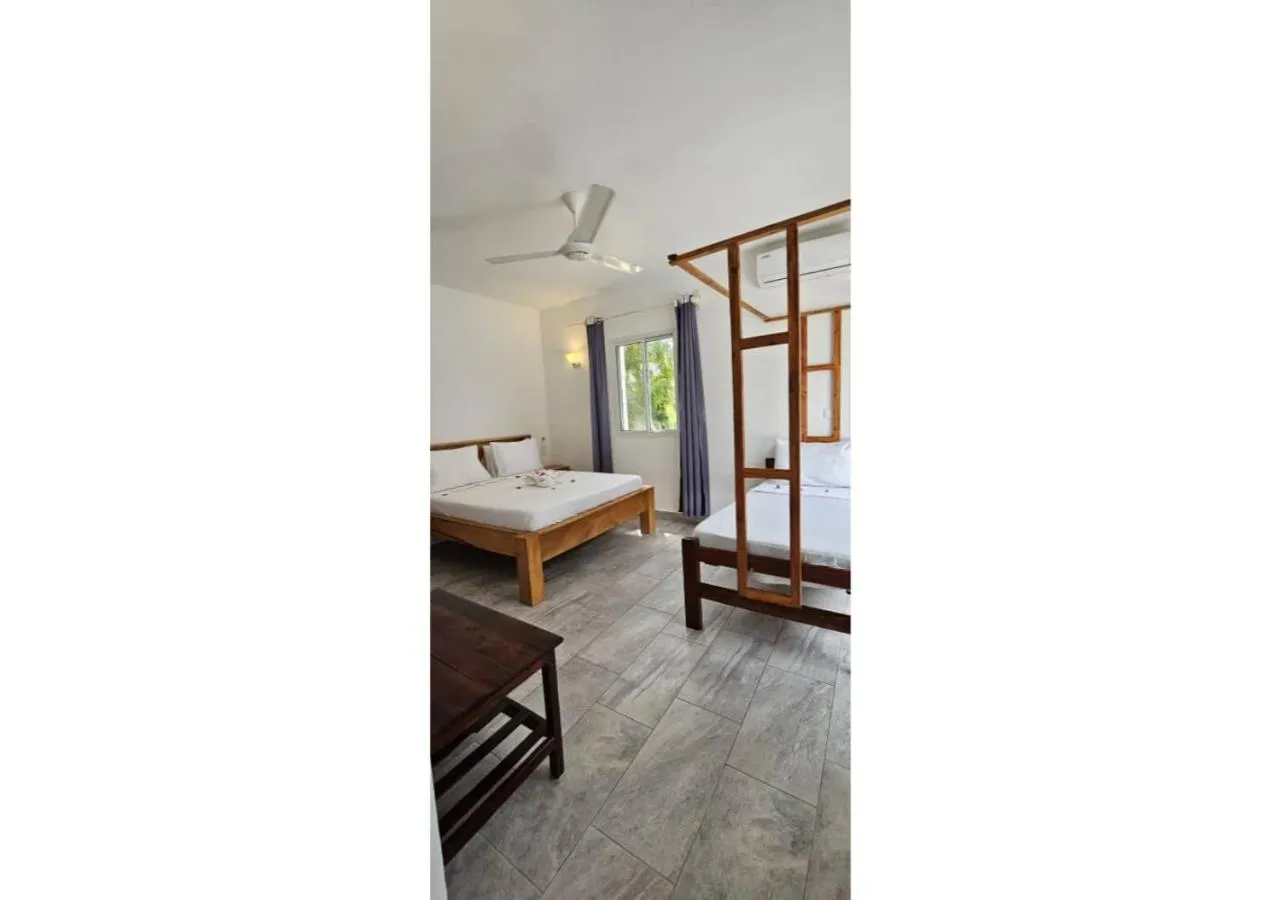 Bed in Sipano Beach Lodge Kiwengwa