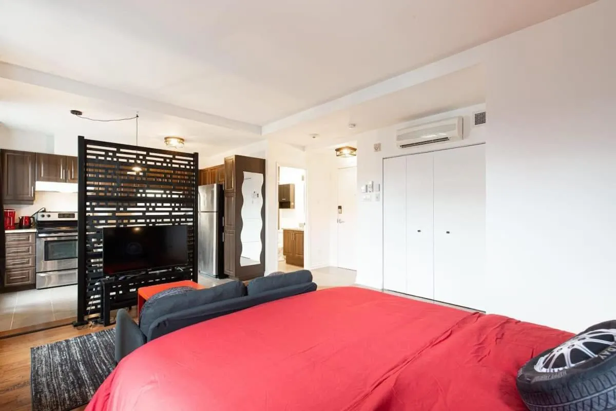 Bed in The Grand Prix Suite In the heart of MTL - M11 Rentals