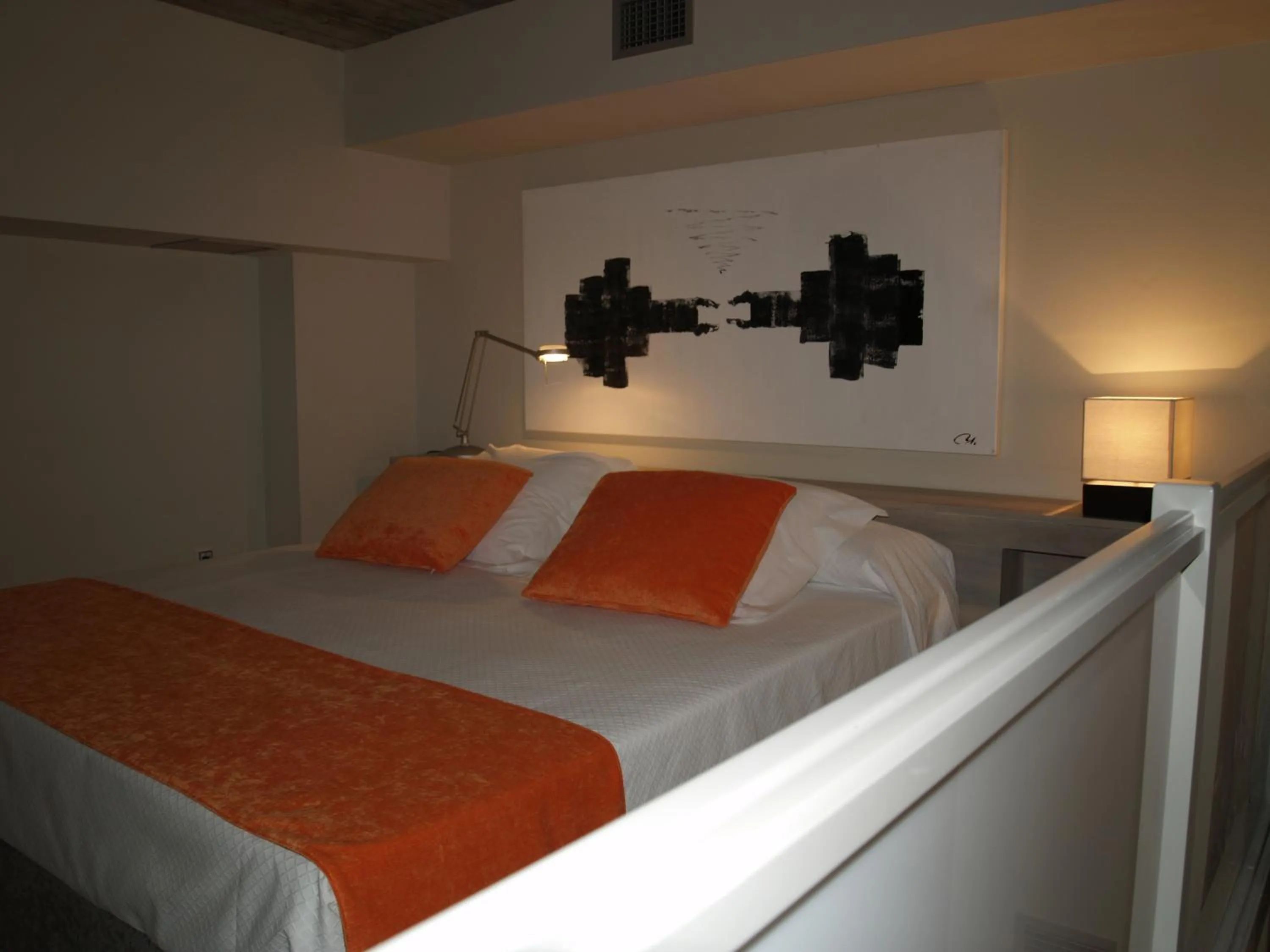 Bed in Eco Alcalá Suites