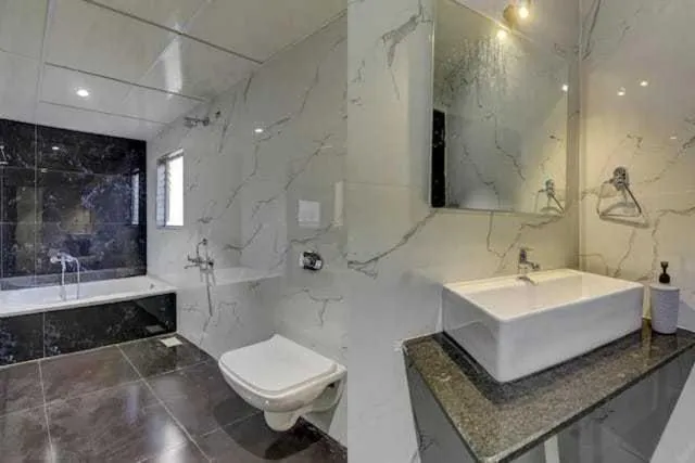 Bathroom in Super Collection O Kesar Inn Banquet & Lodging