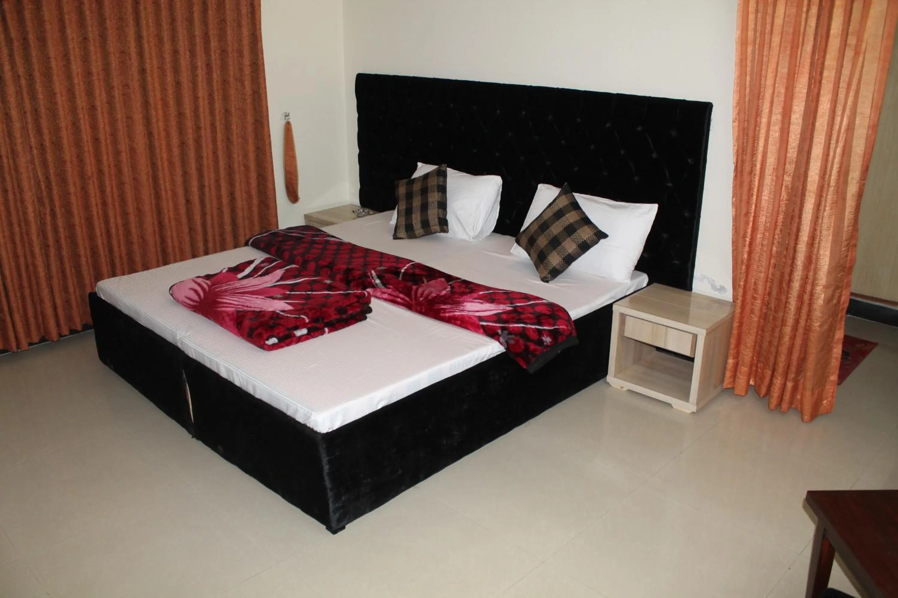 Bed in MUDAN Residency