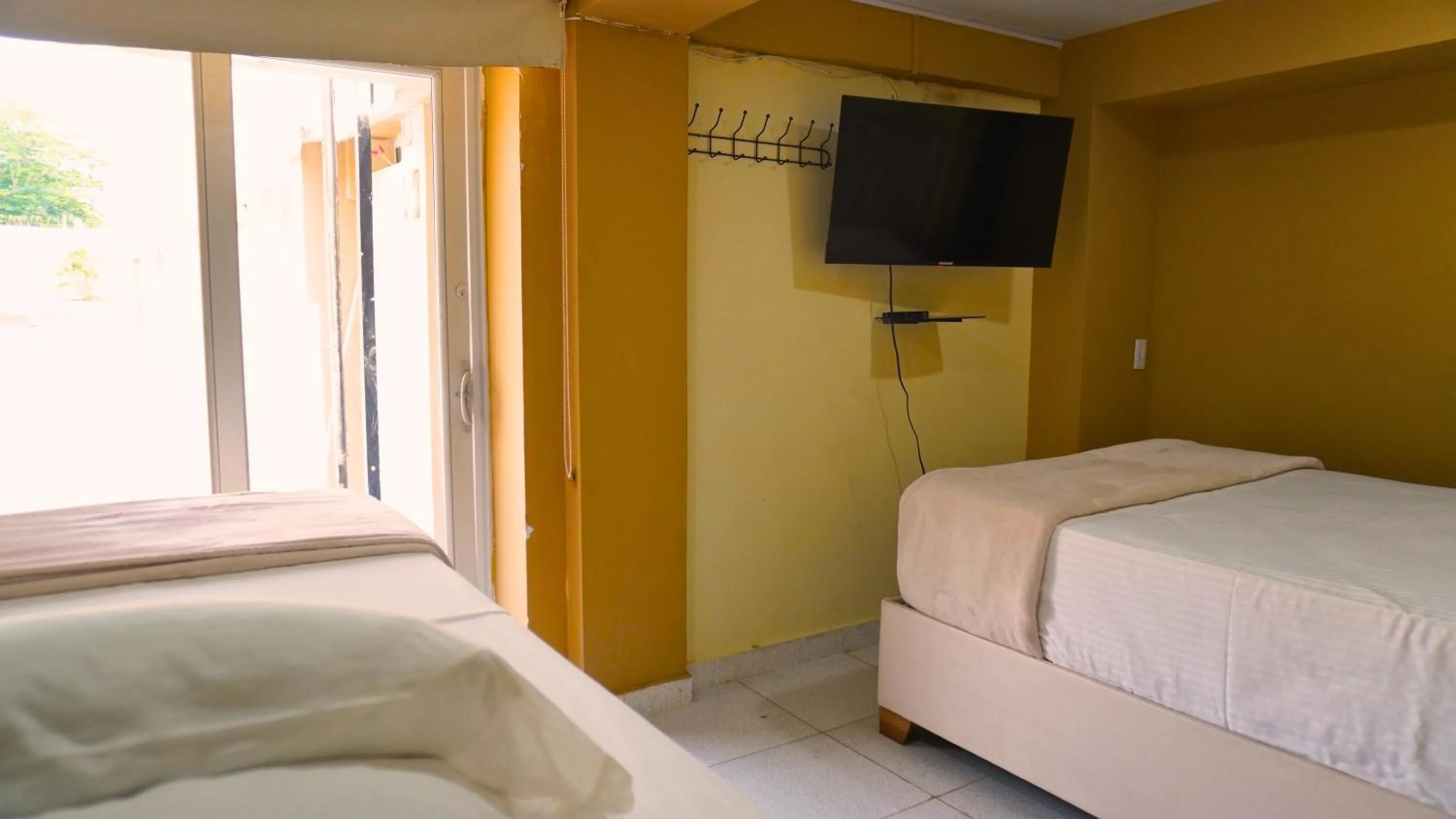 Bedroom, Bed in Hotel y Cabañas Covemar