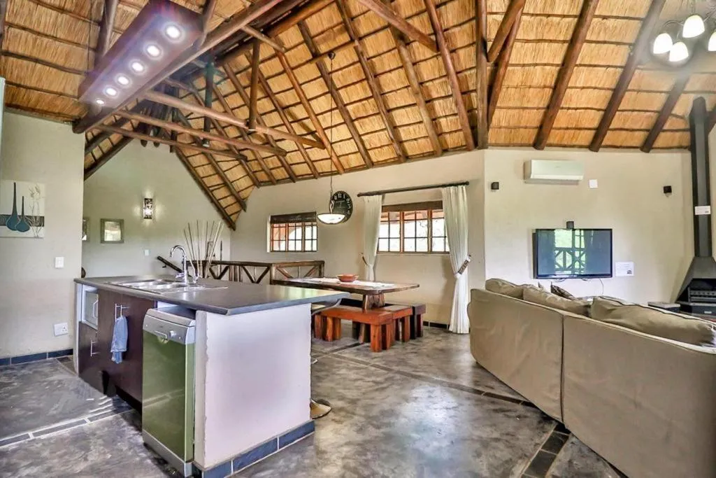 Communal lounge/ TV room in Kruger Escape - Solar System