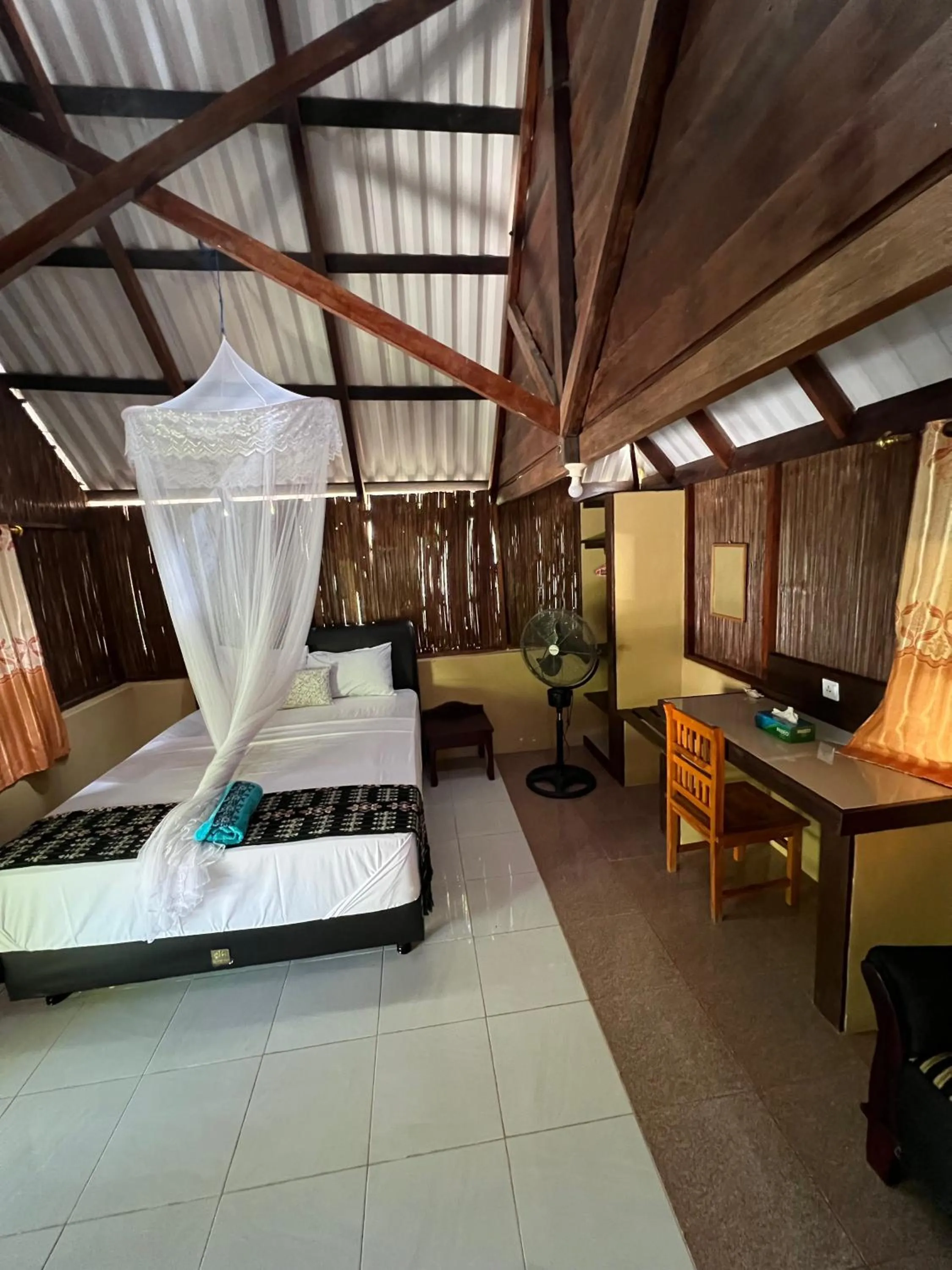 Bed in Rote Surf Resort - Lualemba Bungalows