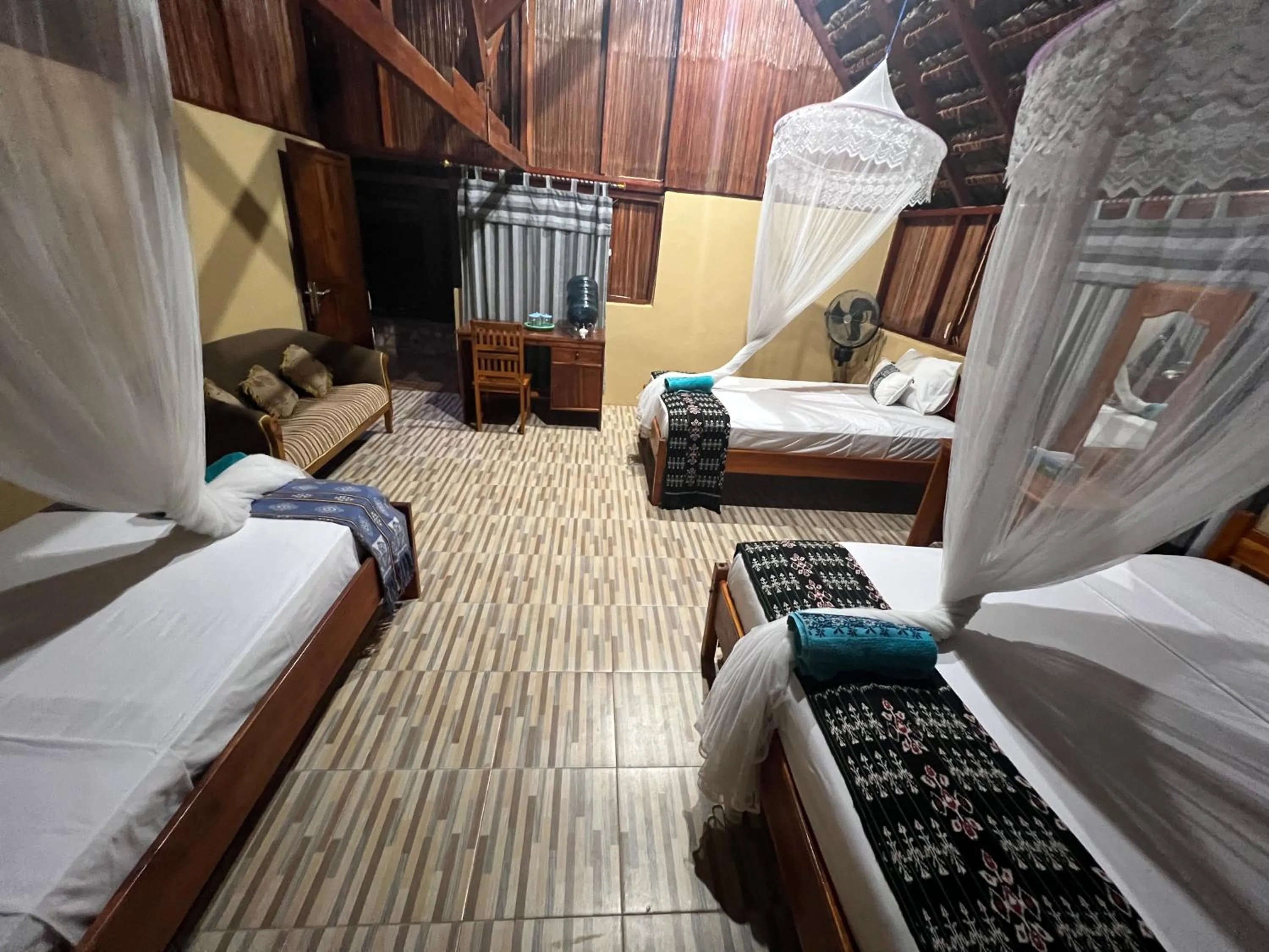 Bed in Rote Surf Resort - Lualemba Bungalows