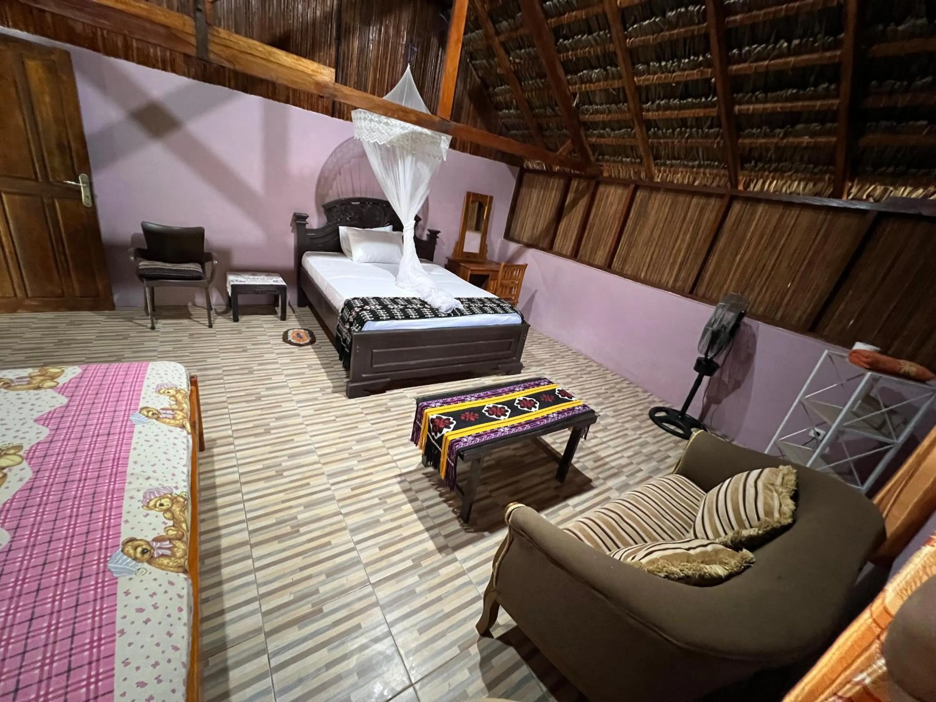 Bed in Rote Surf Resort - Lualemba Bungalows