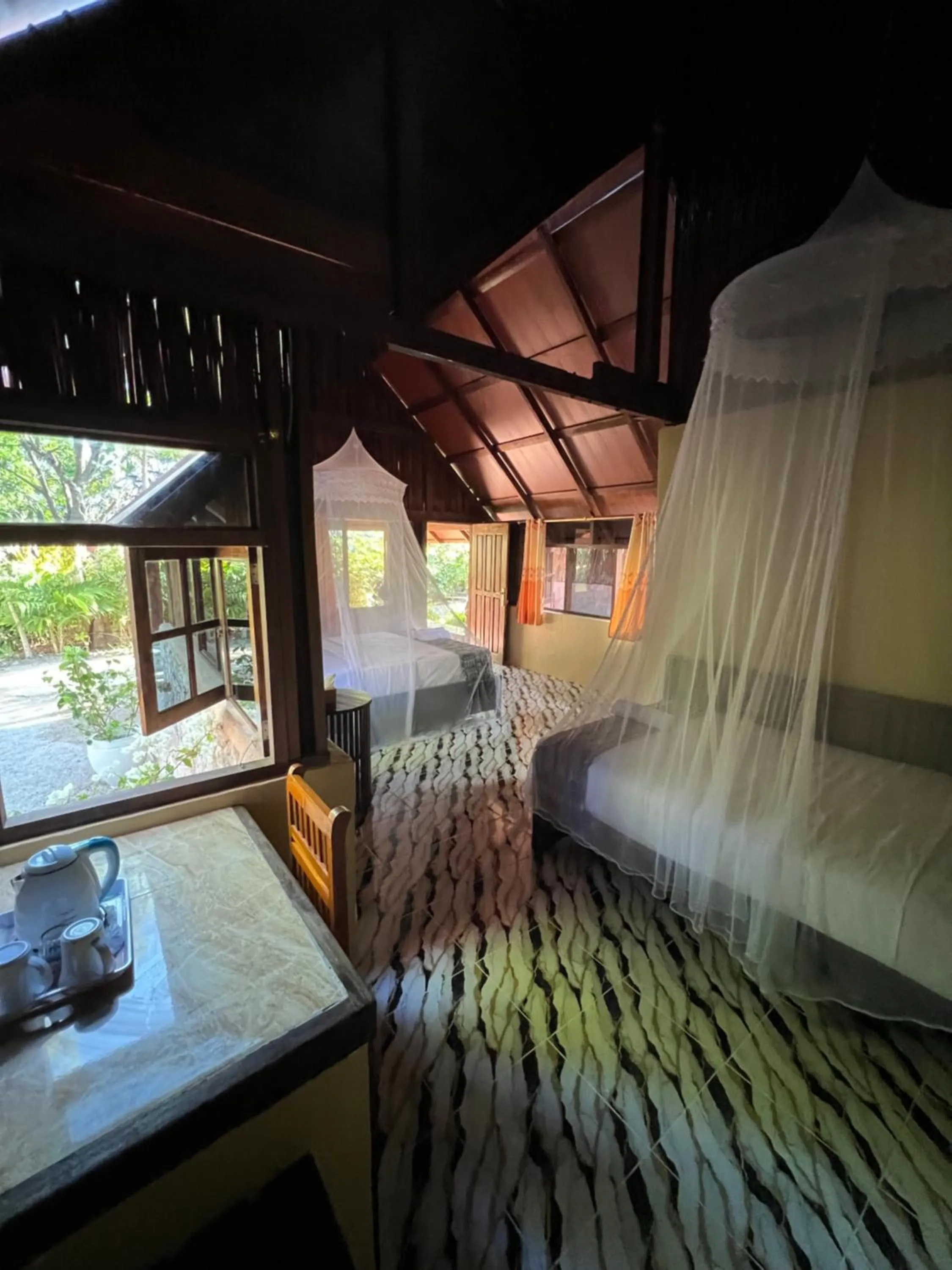 Photo of the whole room, Bed in Rote Surf Resort - Lualemba Bungalows