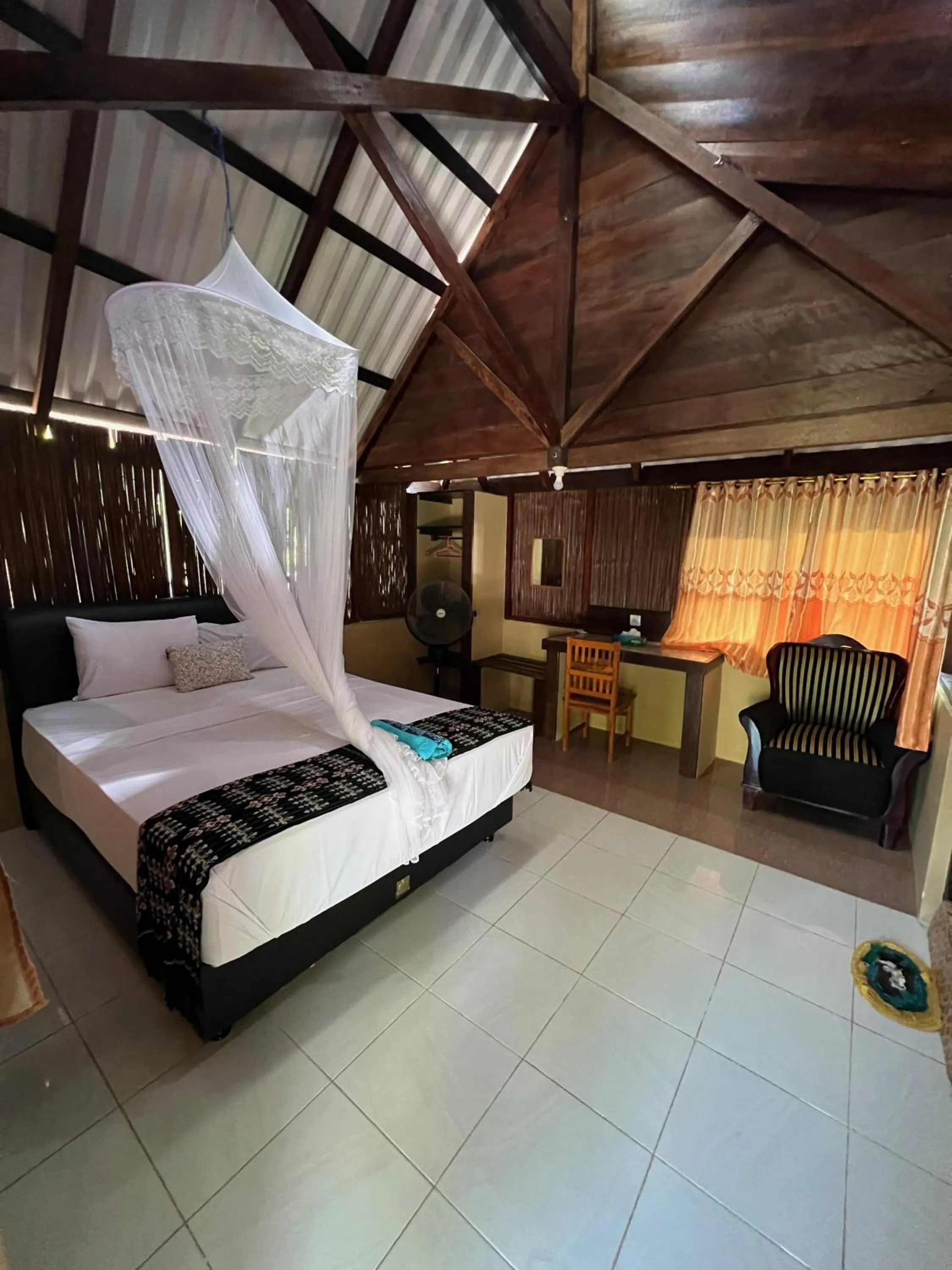 Bed in Rote Surf Resort - Lualemba Bungalows