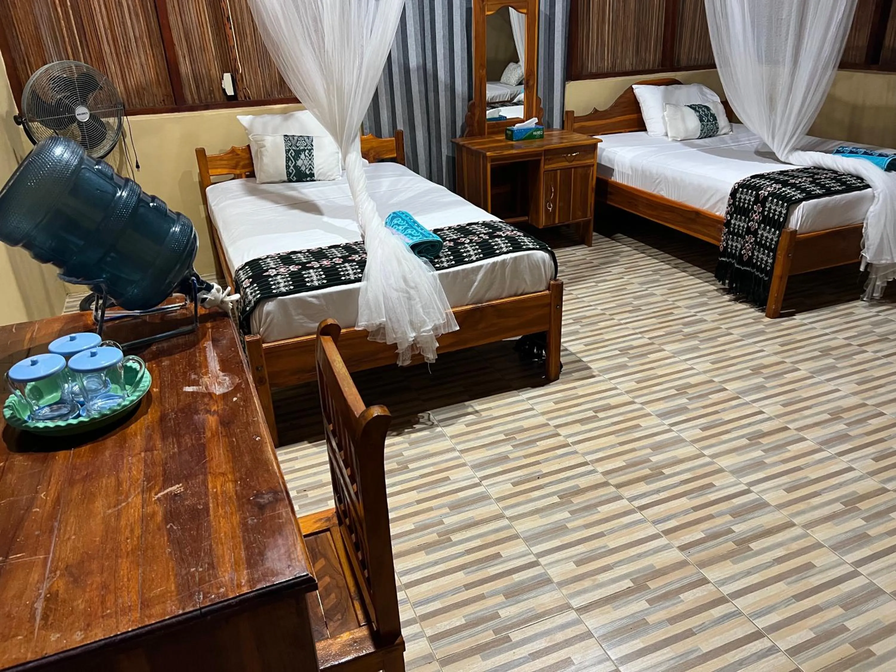 Bed in Rote Surf Resort - Lualemba Bungalows