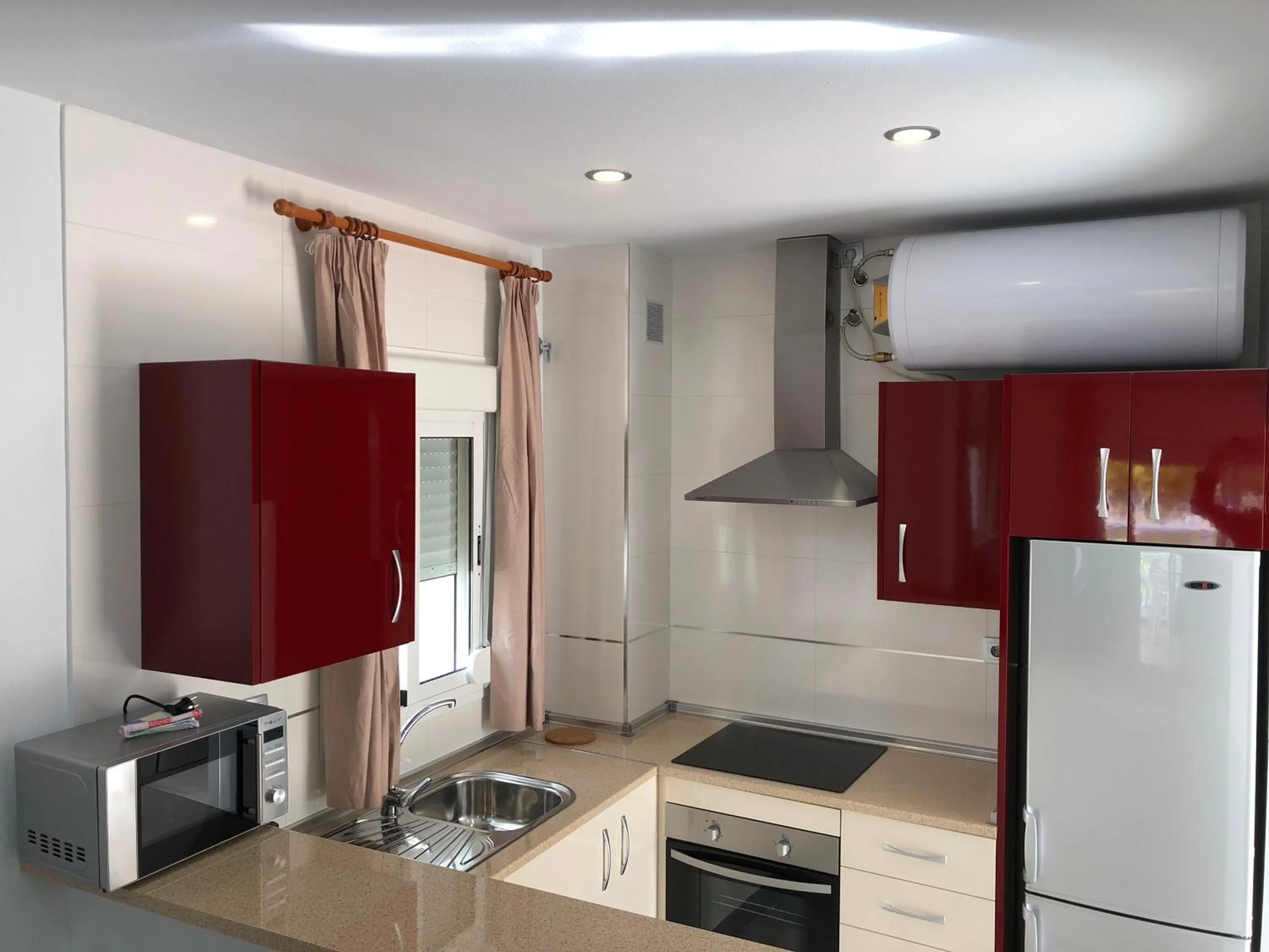 Kitchen or kitchenette in Apartamentos Las Rosas de Capistrano