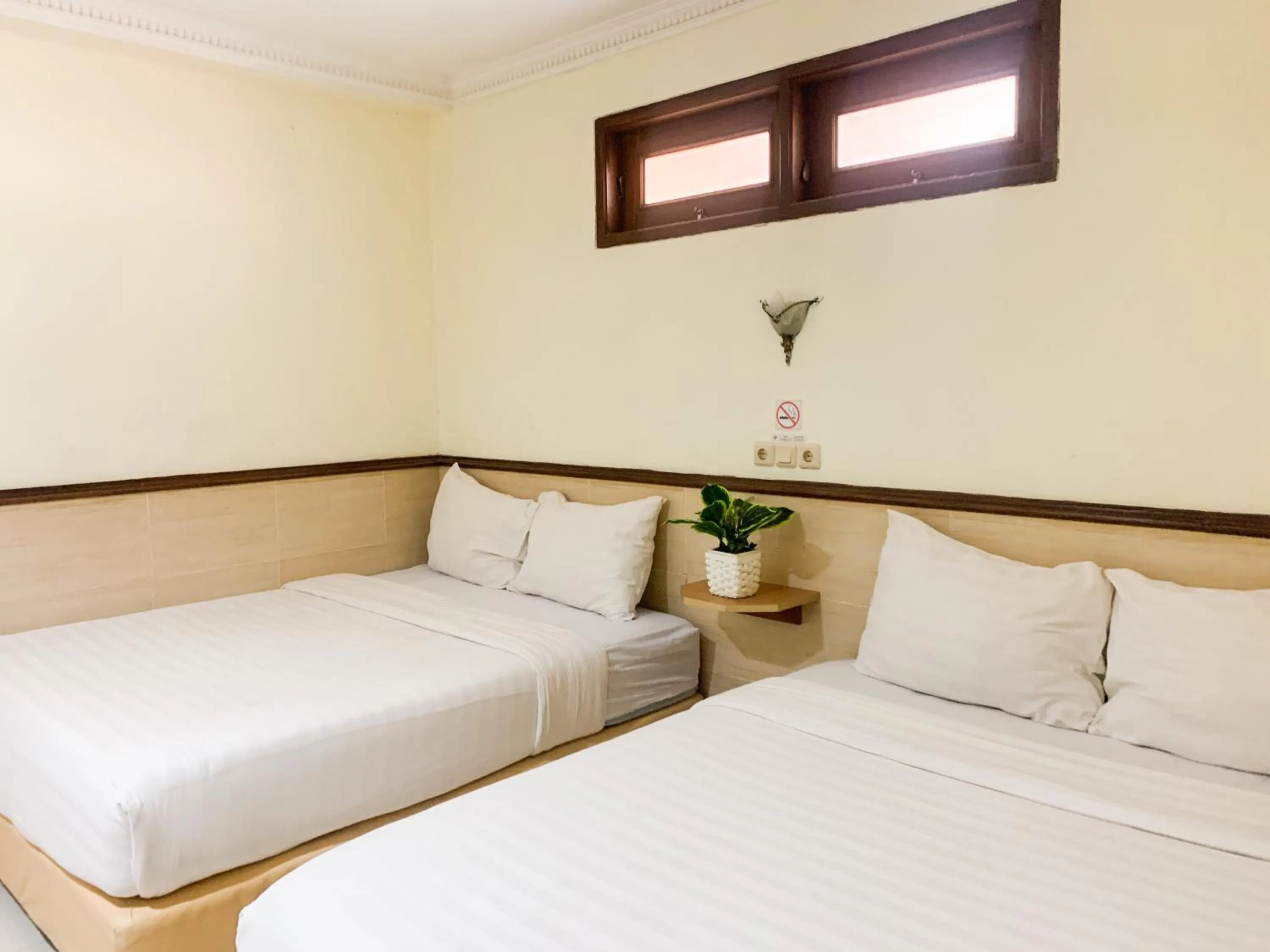 Bedroom in Musafira Hotel Syariah Malioboro Yogyakarta Mitra RedDoorz