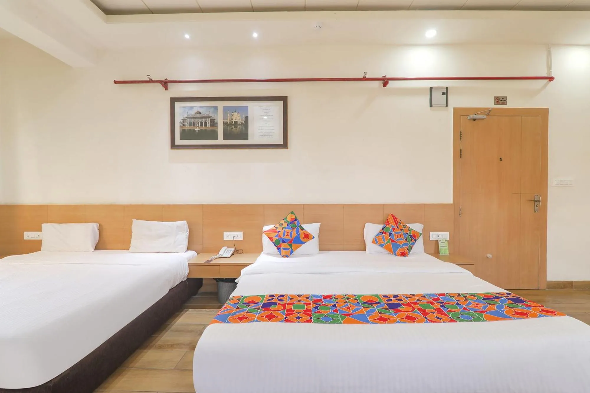 Bed in FabHotel Raghubar Kripa