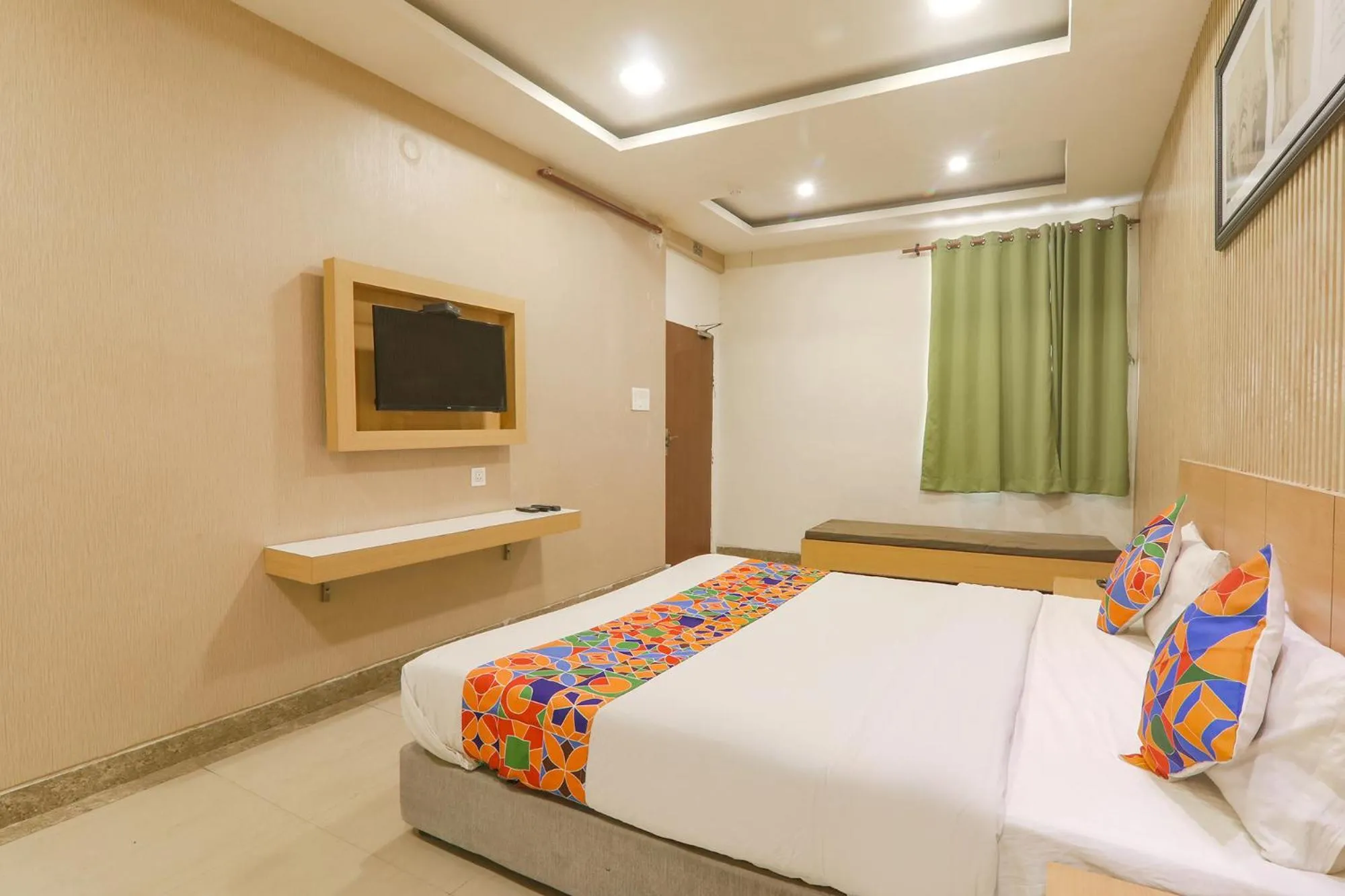 Bed in FabHotel Raghubar Kripa