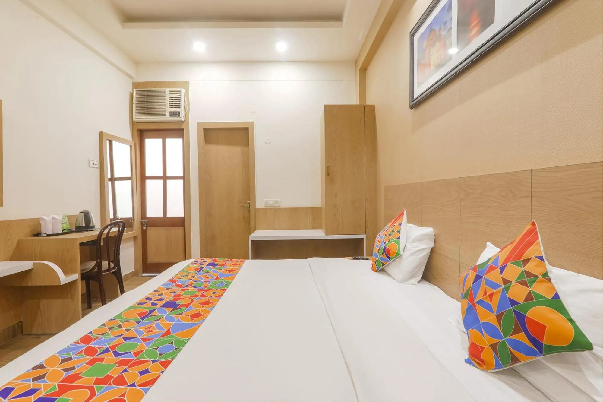 Bed in FabHotel Raghubar Kripa