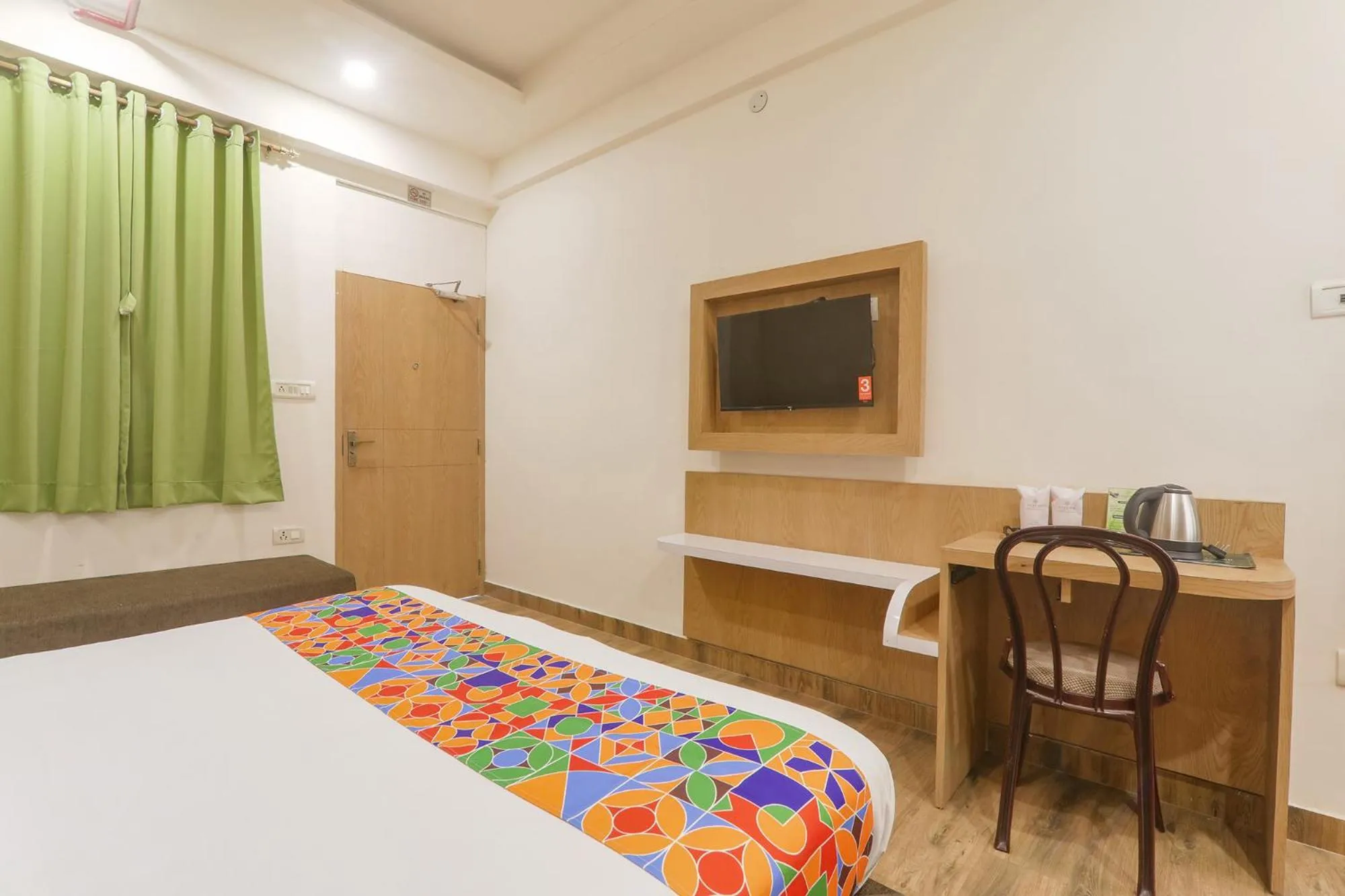 Bed in FabHotel Raghubar Kripa