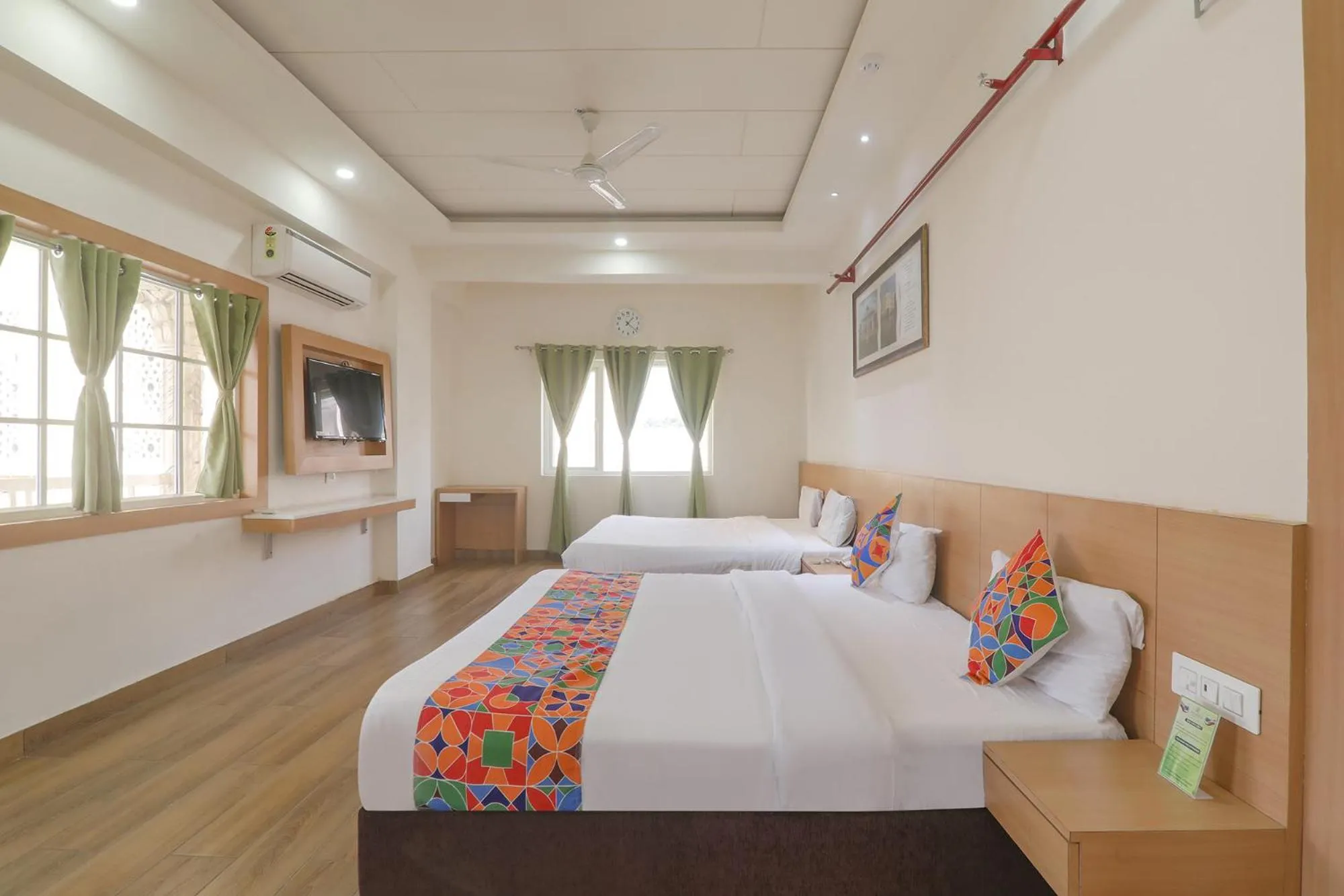 Bed in FabHotel Raghubar Kripa