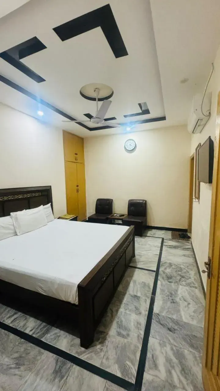 Bed in New Palace Guest House Bed in New Palace Guest House