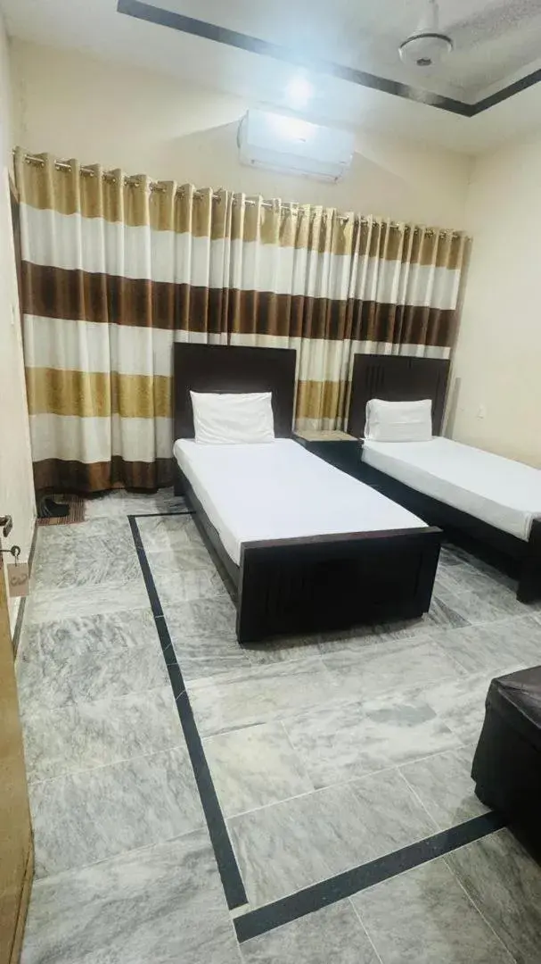 Bed in New Palace Guest House Bed in New Palace Guest House