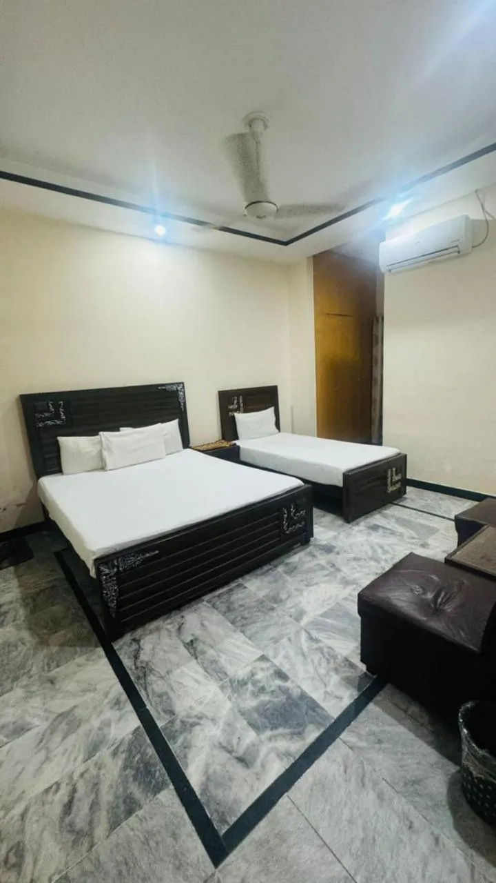 Bed in New Palace Guest House