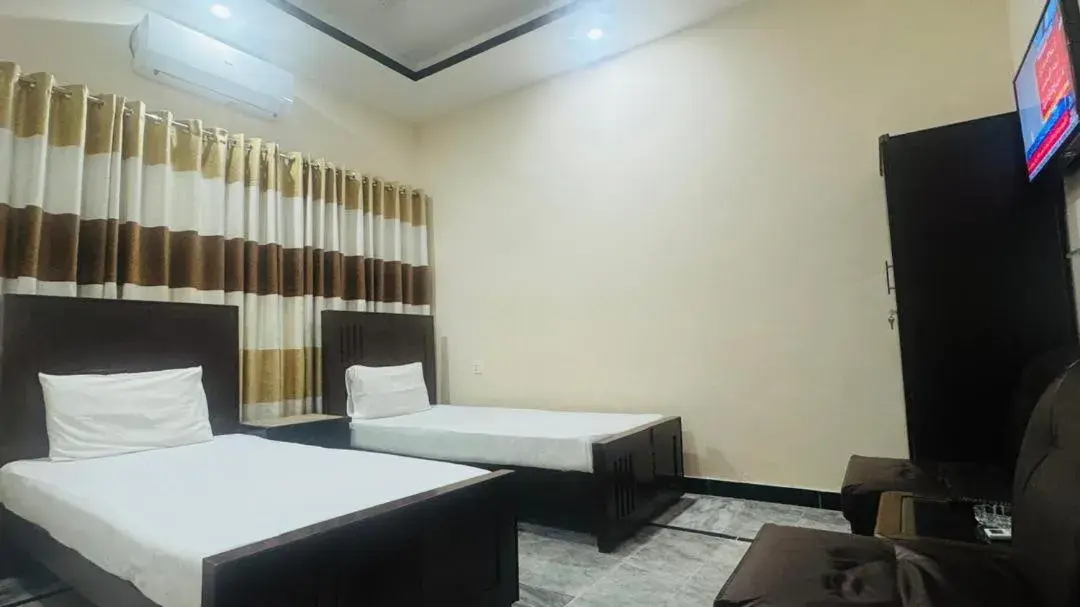 Bed in New Palace Guest House Bed in New Palace Guest House