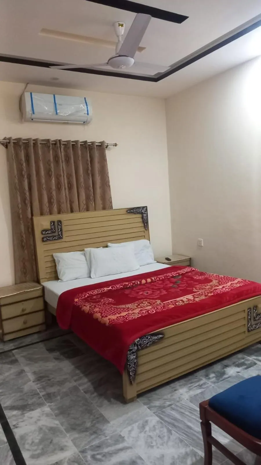 Bed in New Palace Guest House