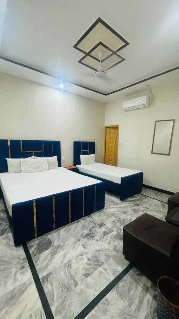 Bed in New Palace Guest House Bed in New Palace Guest House