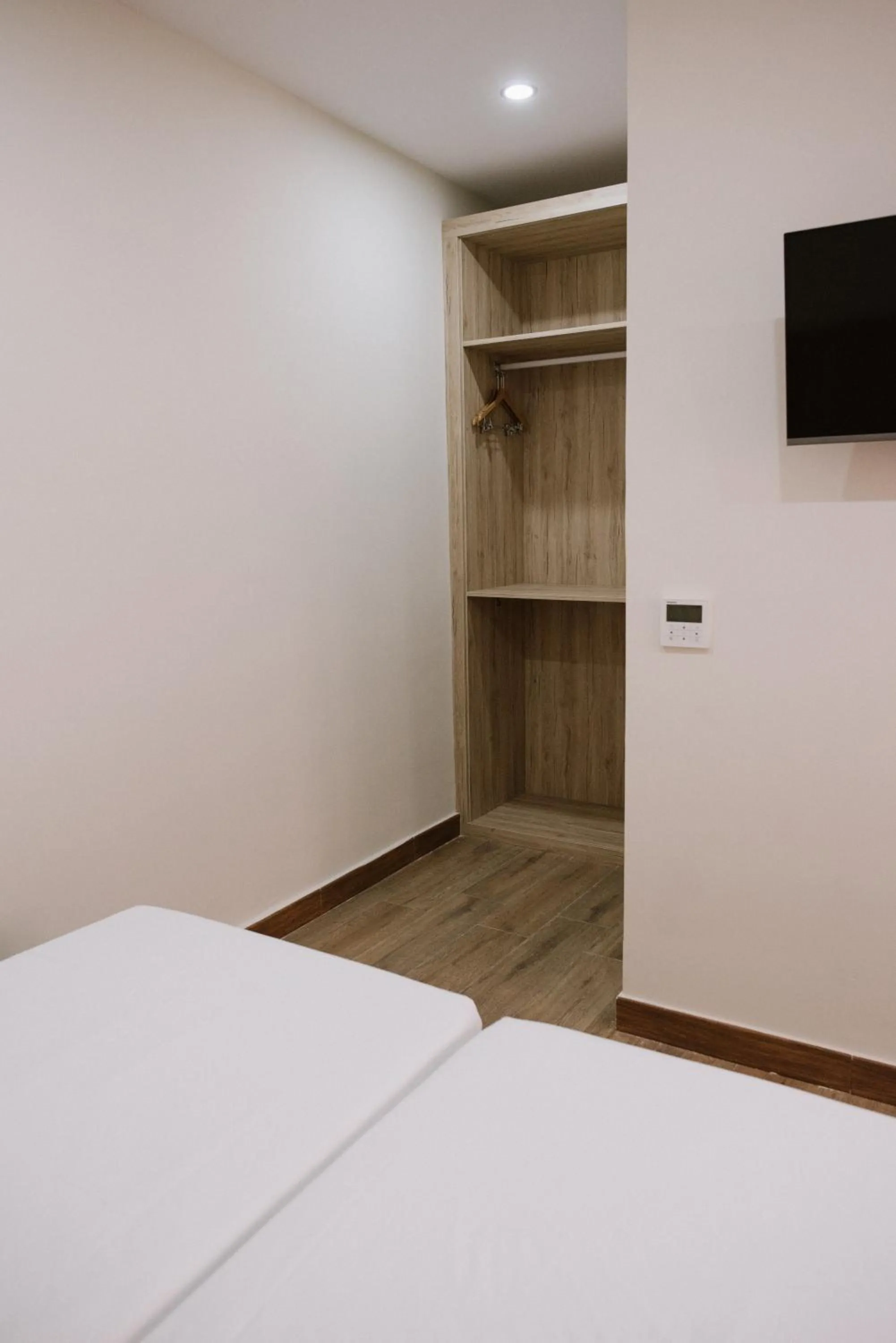 wardrobe, Bed in Hotel Melilla Centro