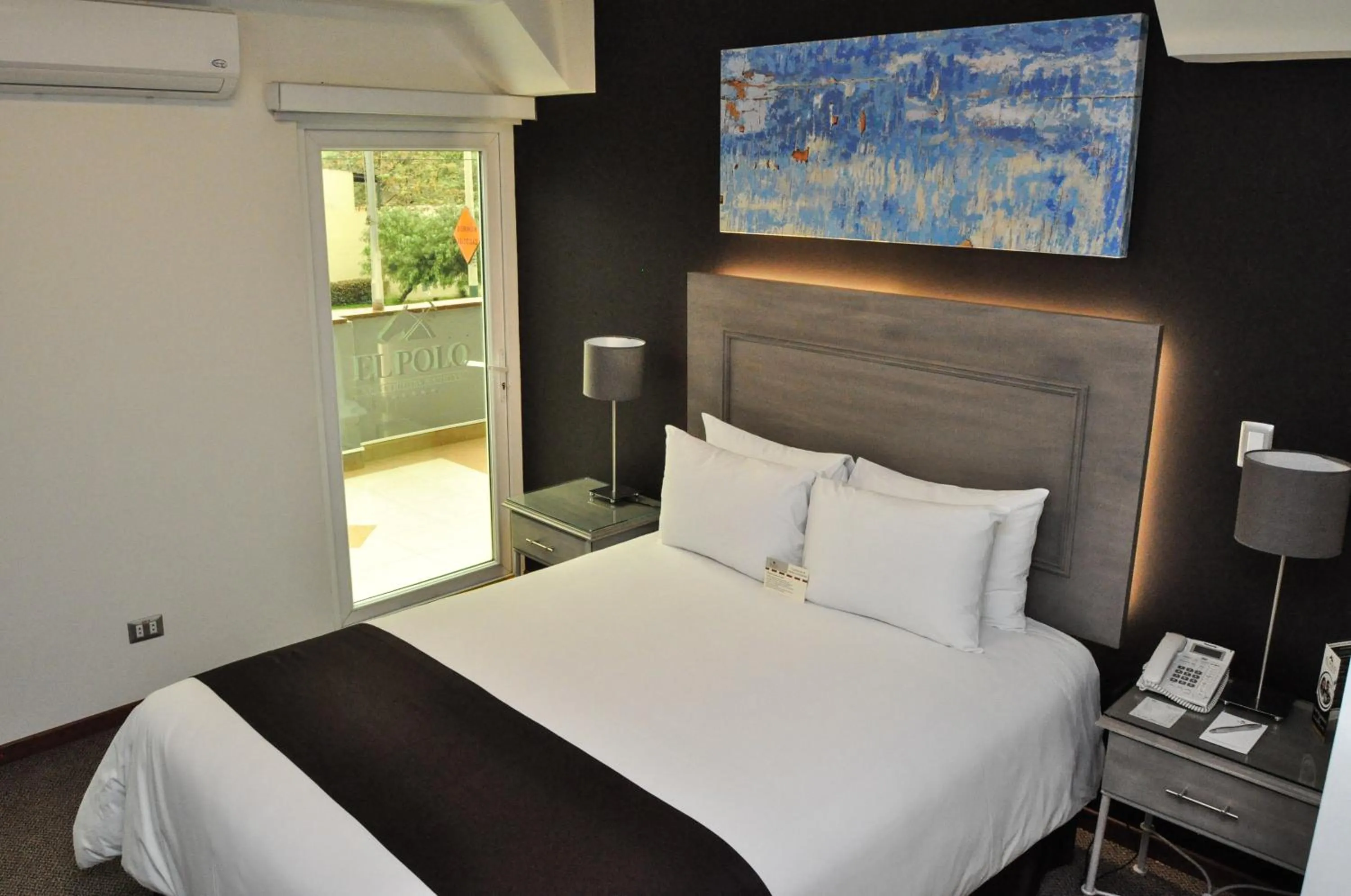 Bed in El Polo Hotel & Suites