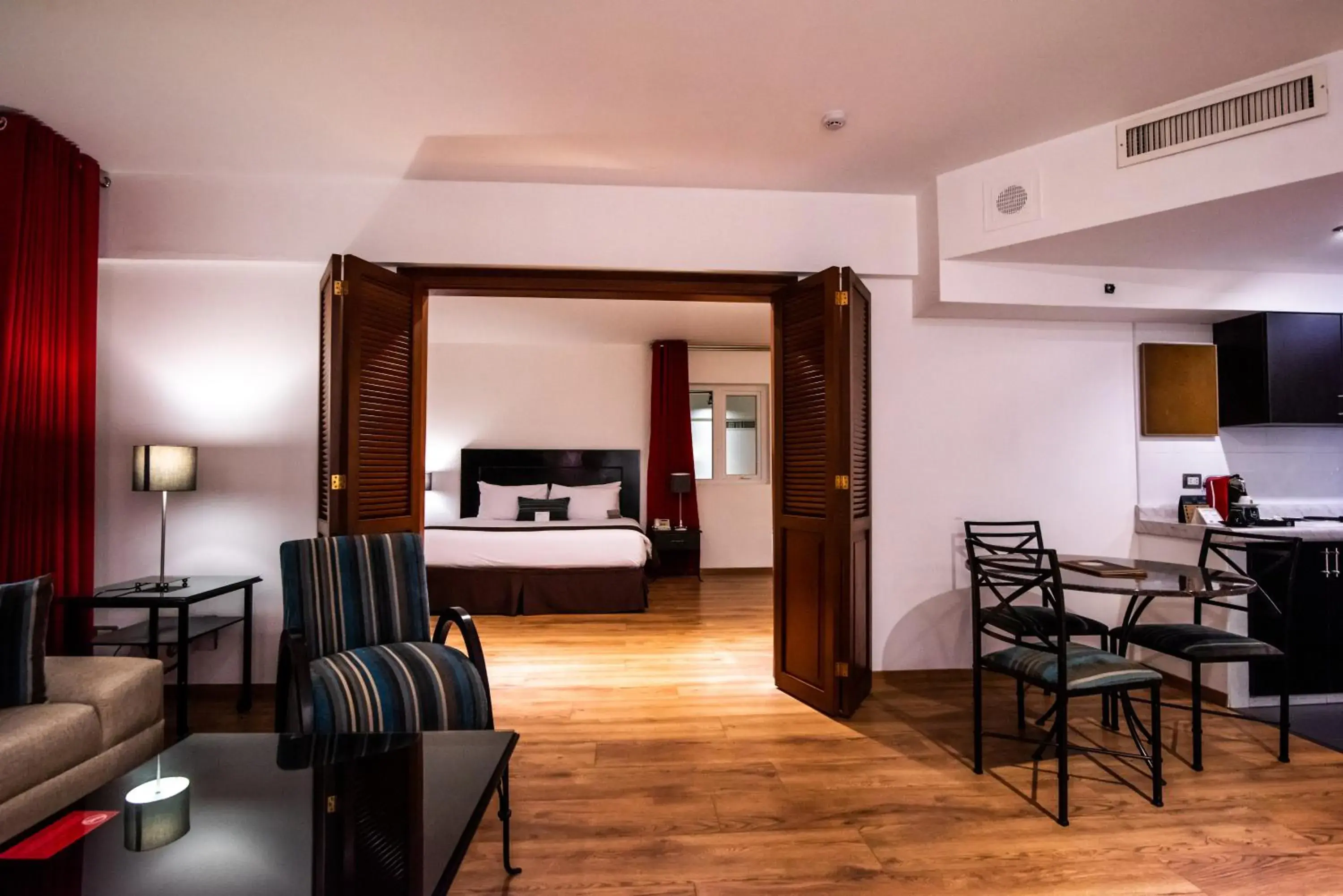 Living room, Bed in El Polo Hotel & Suites Living room, Bed in El Polo Hotel & Suites