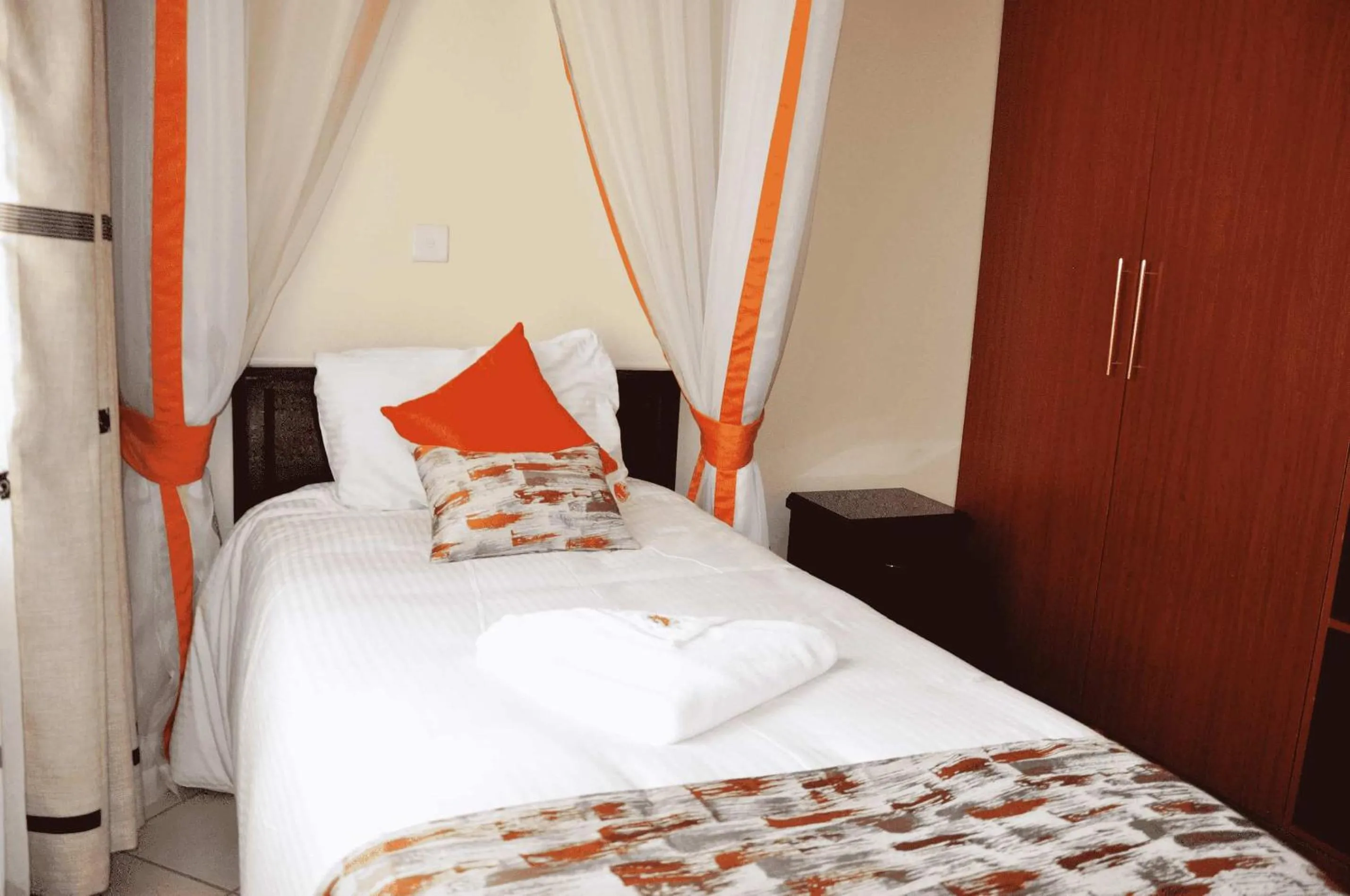 Bed in The Radix Hotel Limited