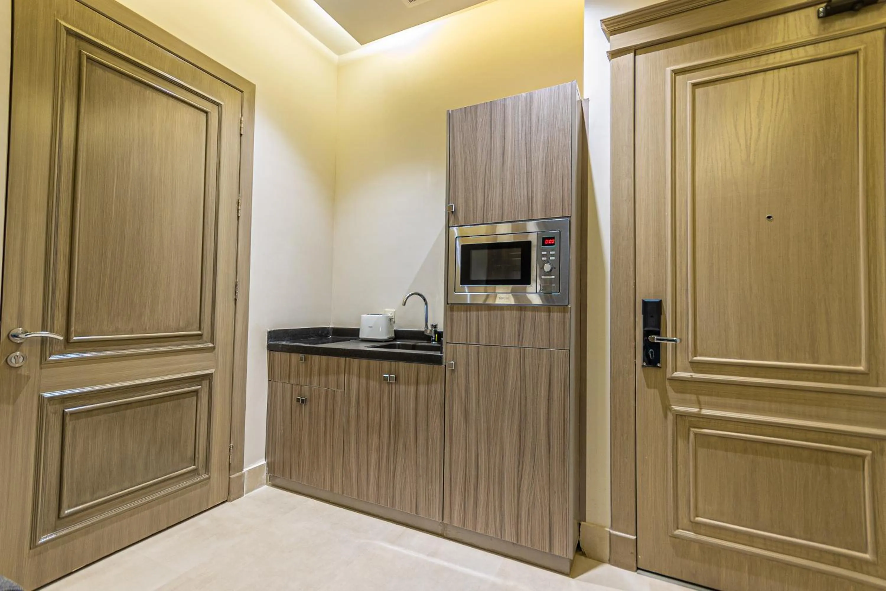 Kitchen or kitchenette in Land Walk Hotel Al Taawun Riyadh