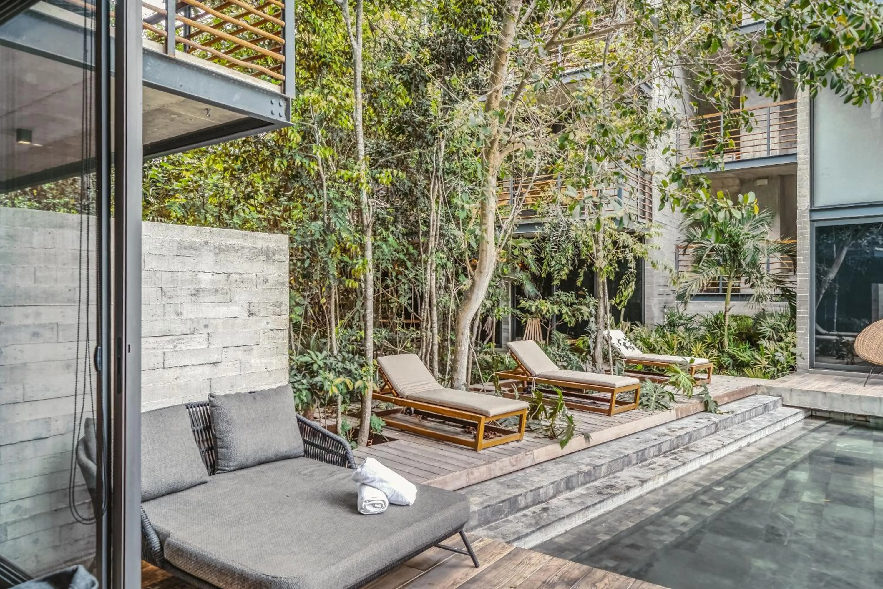 Patio in Incredible 1BR Swim Up with Private Cenote and Big Gym