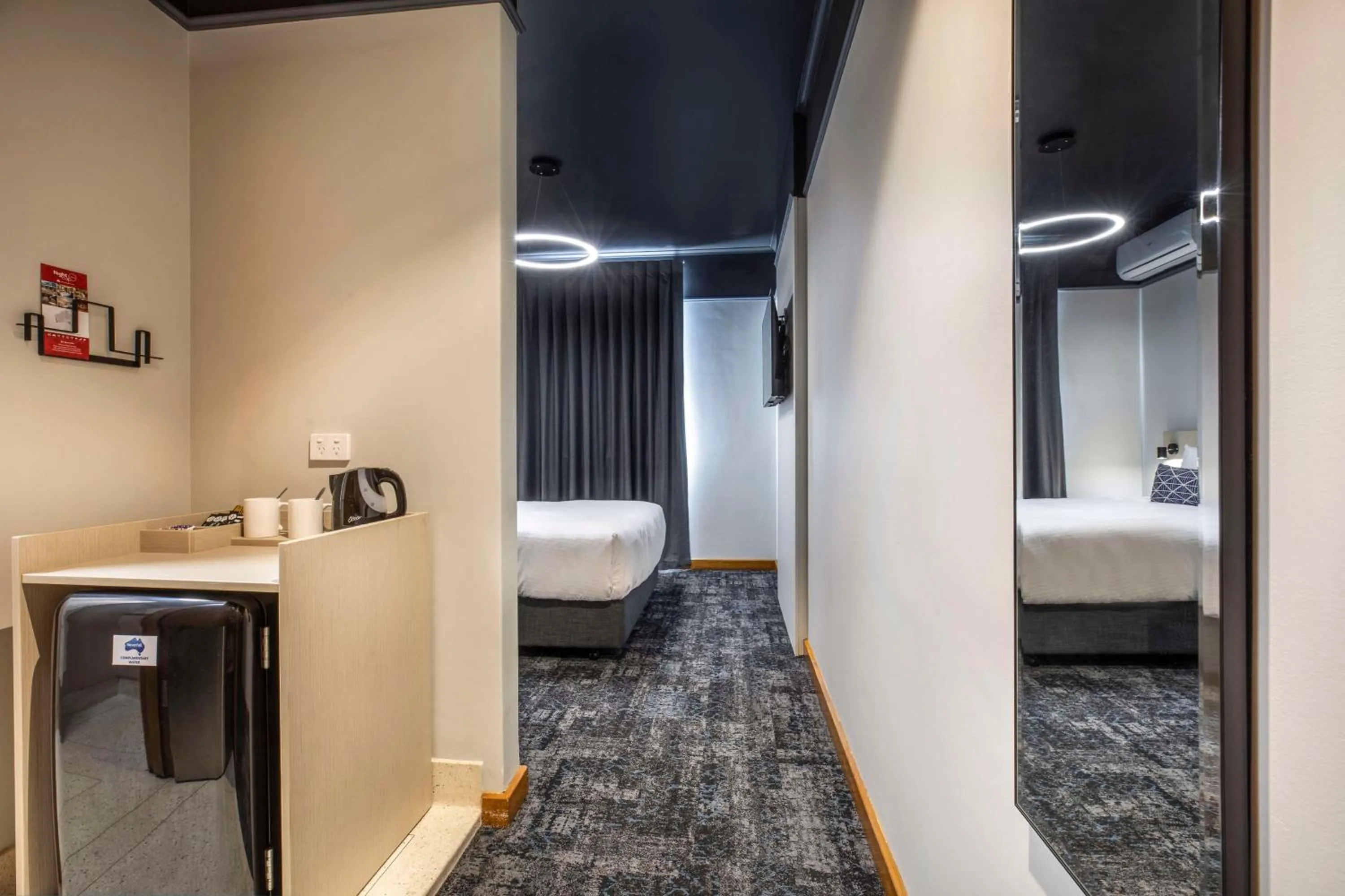 Bedroom, Bed in Nightcap at Empire Hotel