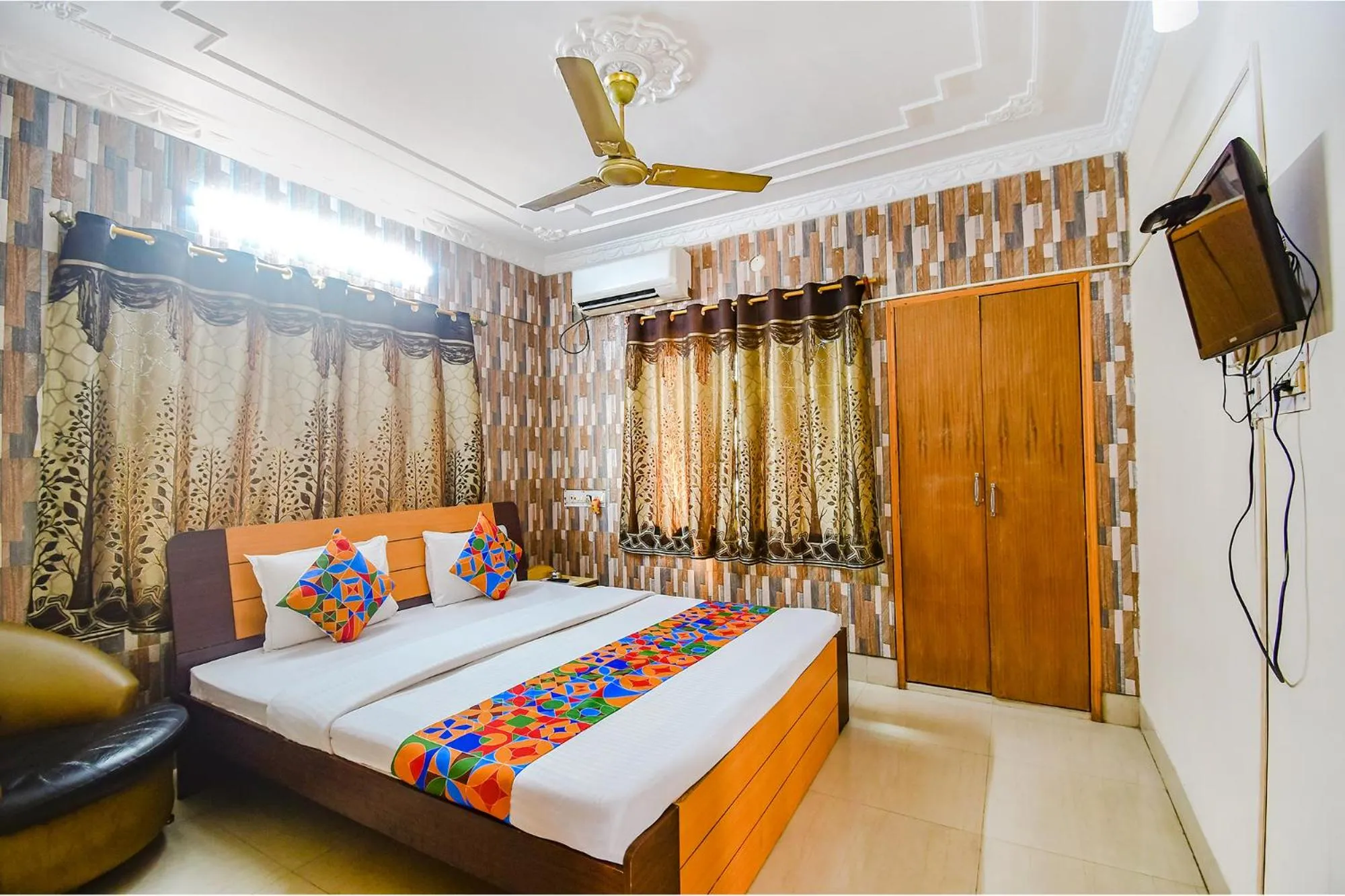 Bed in FabHotel Heritage Inn