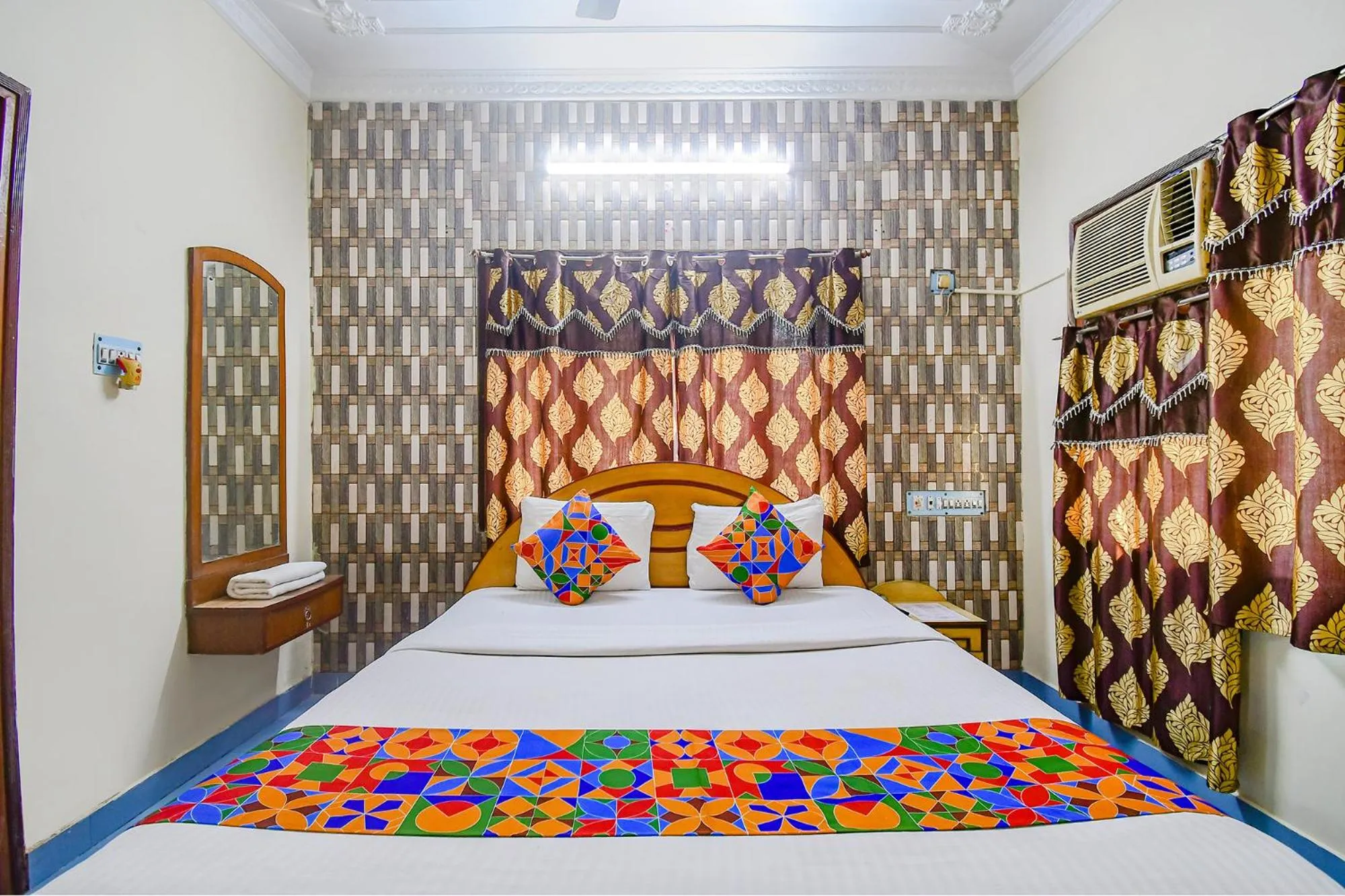 Bed in FabHotel Heritage Inn