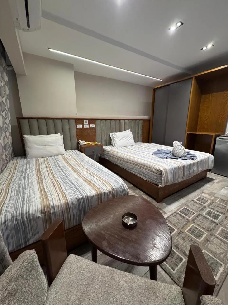 Bed in Garden City Plaza Hotel