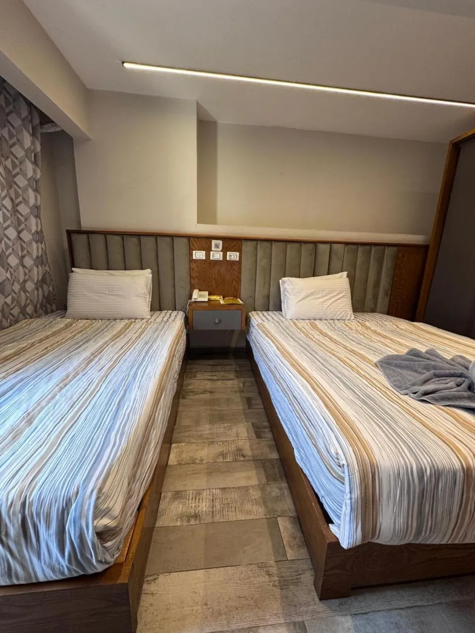 Bed in Garden City Plaza Hotel